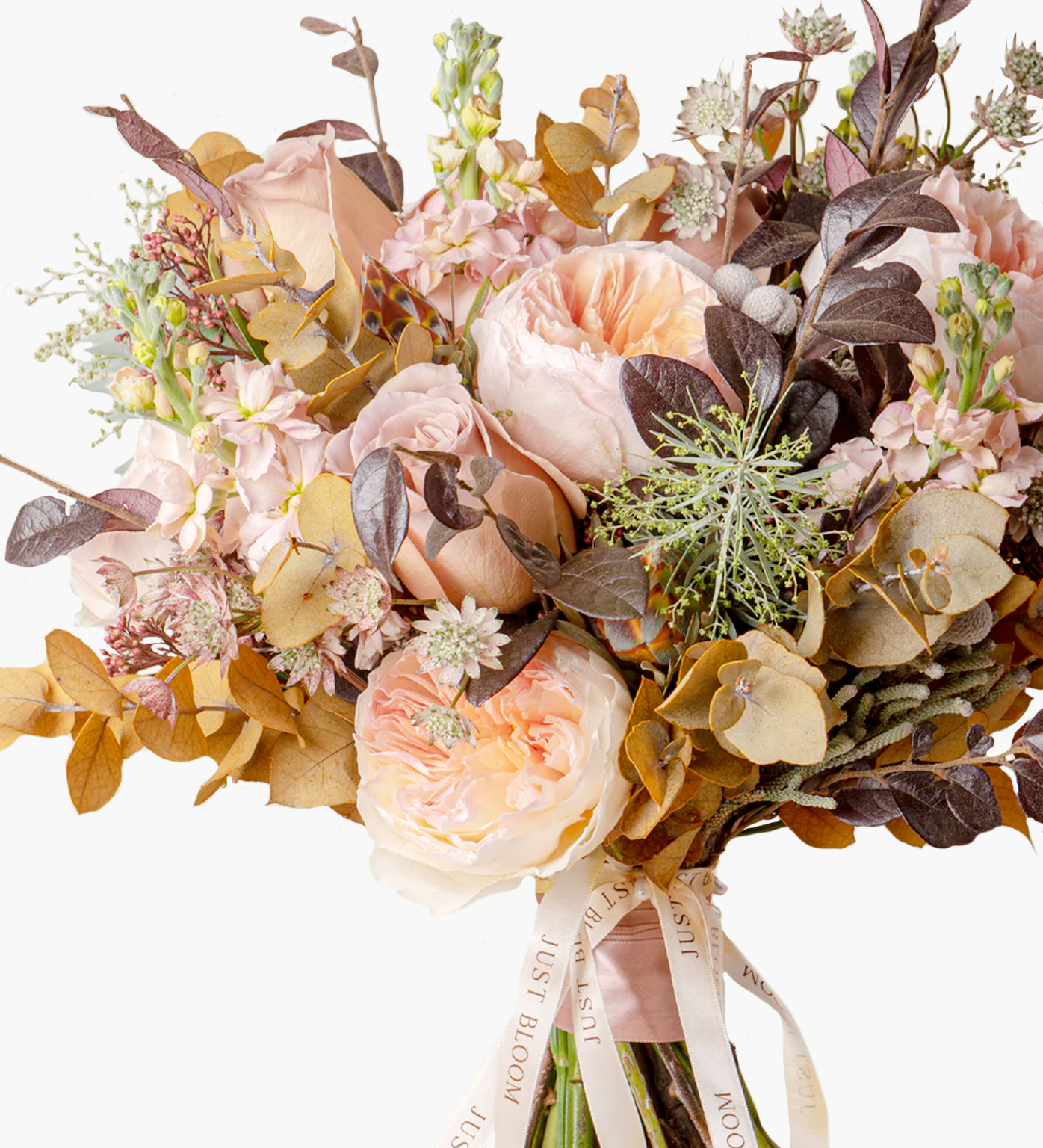 Close-up of Everly bouquet showing peach roses, fillers, and natural foliage details