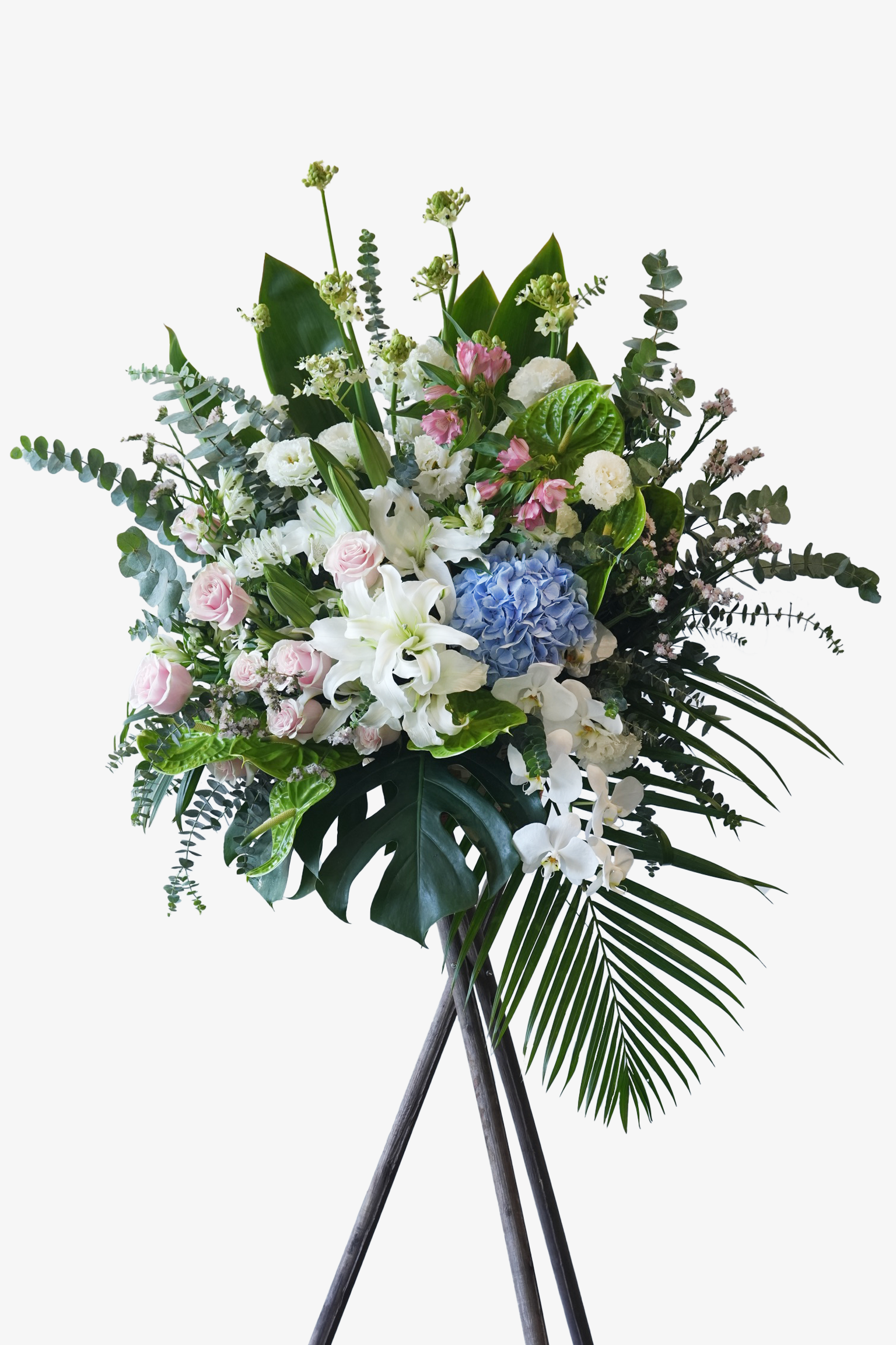 Just Bloom Frankie grand opening flower stand with pastel roses, blue hydrangeas, white lilies, and tropical leaves in Hong Kong