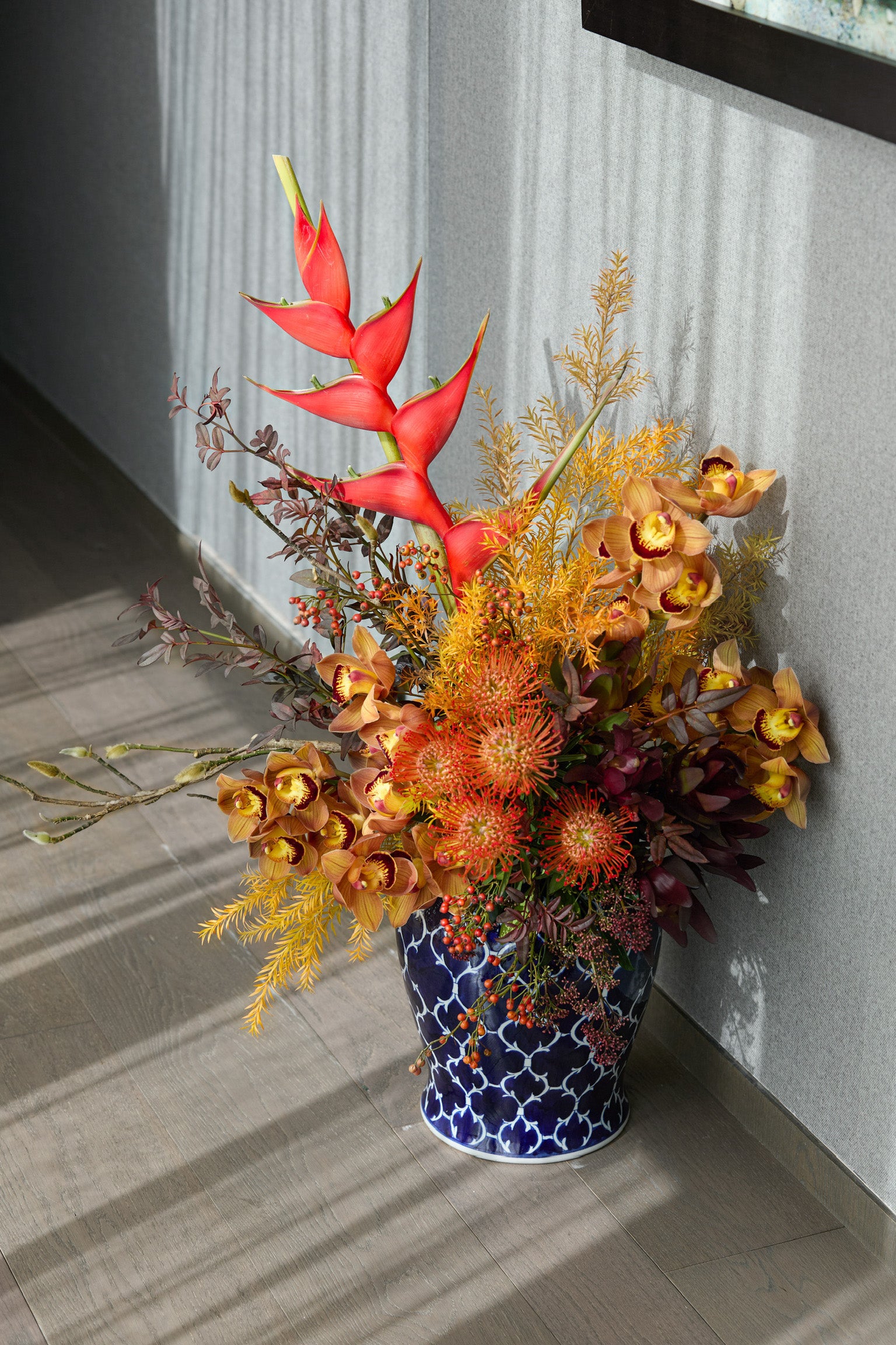 Premium tropical Chinese New Year flowers with orange protea bronze cymbidium and heliconia luxury CNY Hong Kong