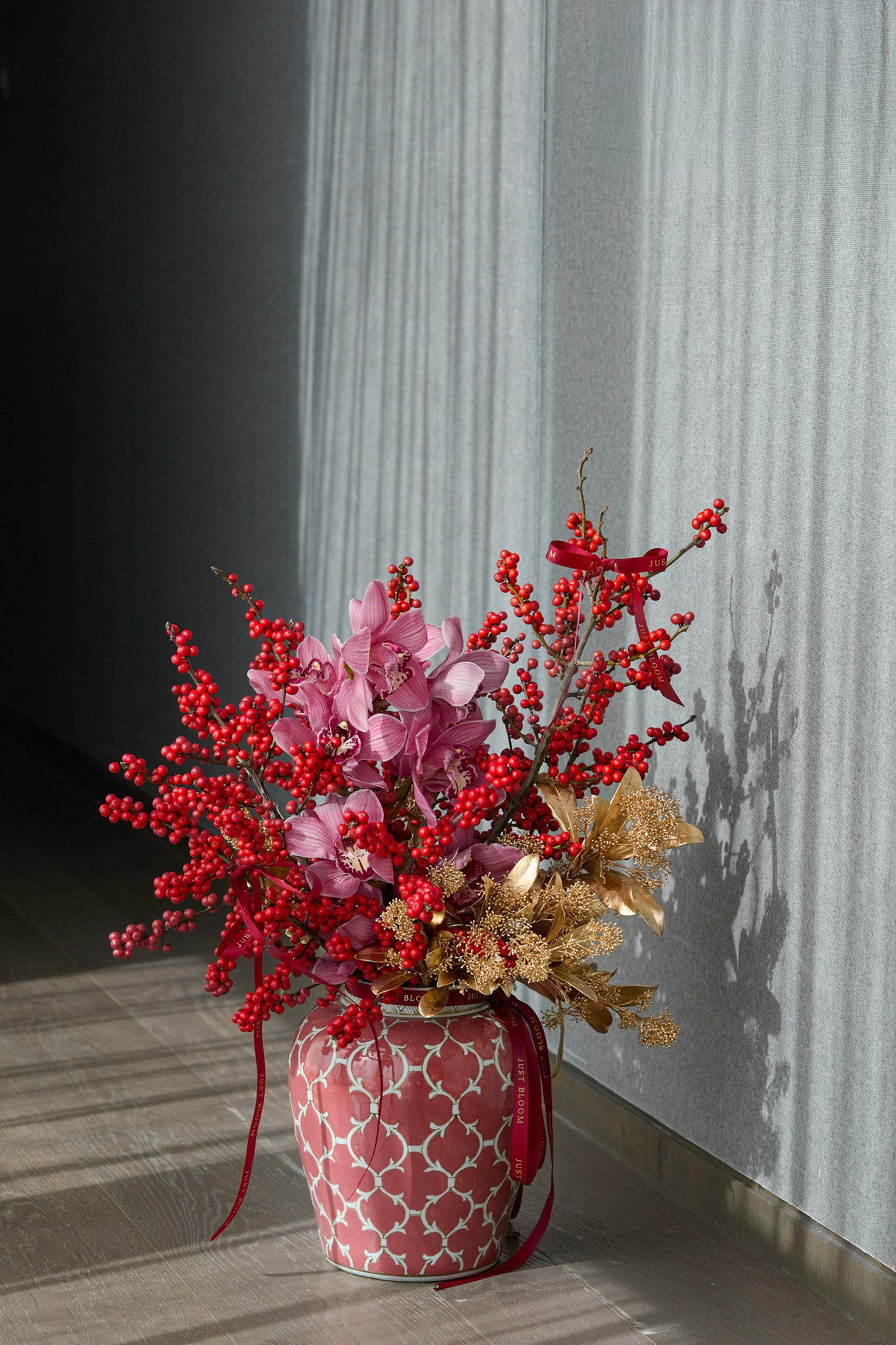 Year of the Horse elegant floral design featuring pink orchids abundant red berries symbolizing prosperity Chinese New Year Hong Kong