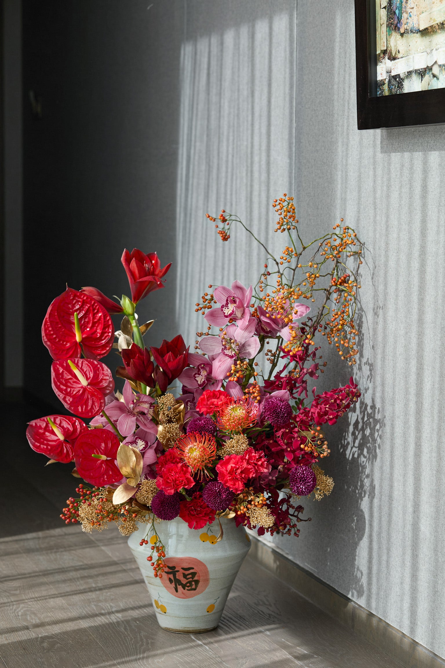 Premium grand Chinese New Year arrangement with multiple blooms red anthurium pink orchid burgundy dahlia luxury CNY Just Bloom