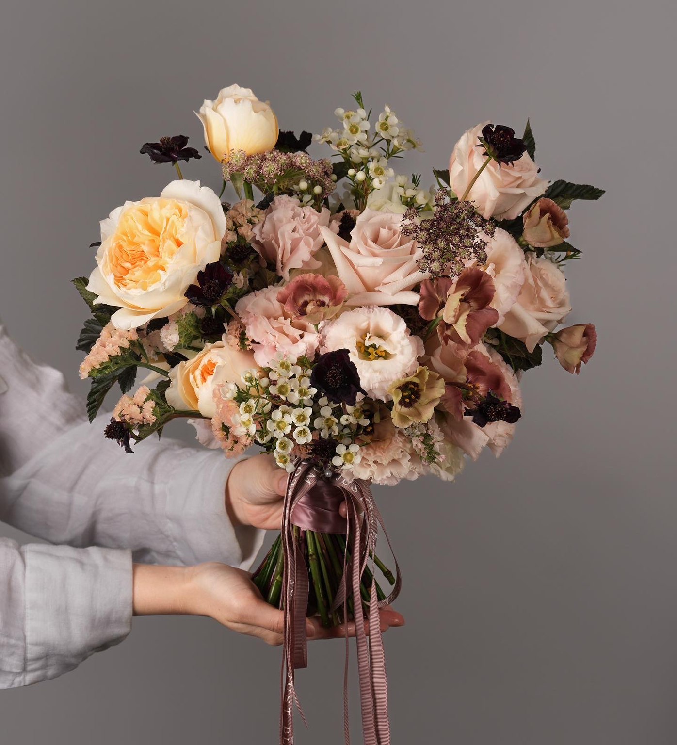 Close-up of Matilda vintage peach and brown bridal bouquet featuring Ecuadorian garden roses and delicate Dutch blooms