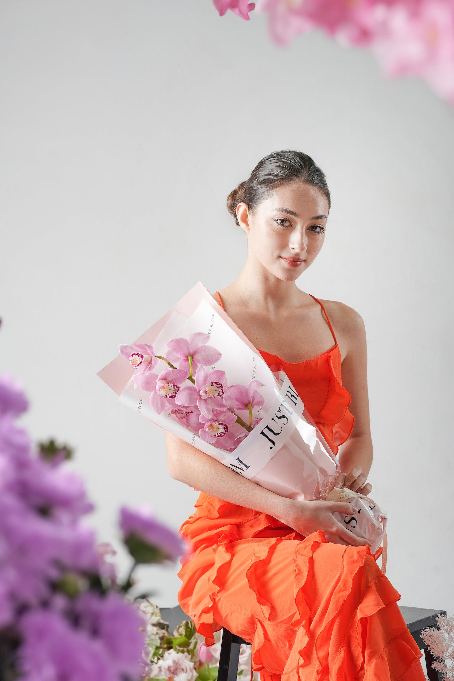 A Letter to Mom - A graceful Mother’s Day 2025 bouquet featuring soft pink cymbidium orchids, elegantly wrapped for a heartfelt and minimalist gift. Available for same-day delivery in Hong Kong by Just Bloom