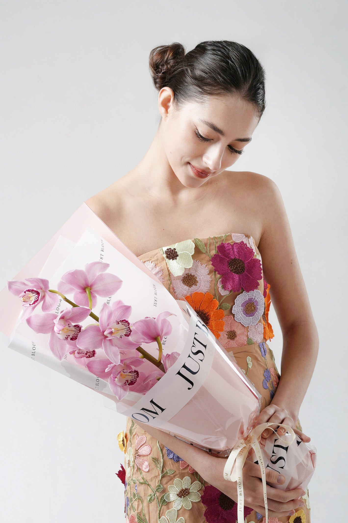 A Letter to Mom - A graceful Mother’s Day 2025 bouquet featuring soft pink cymbidium orchids, elegantly wrapped for a heartfelt and minimalist gift. Available for same-day delivery in Hong Kong by Just Bloom