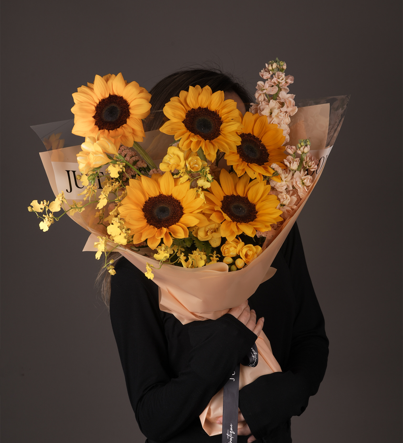 Aisha sunflower bouquet with dancing lady orchids and pastel wrapping - Just Bloom Hong Kong