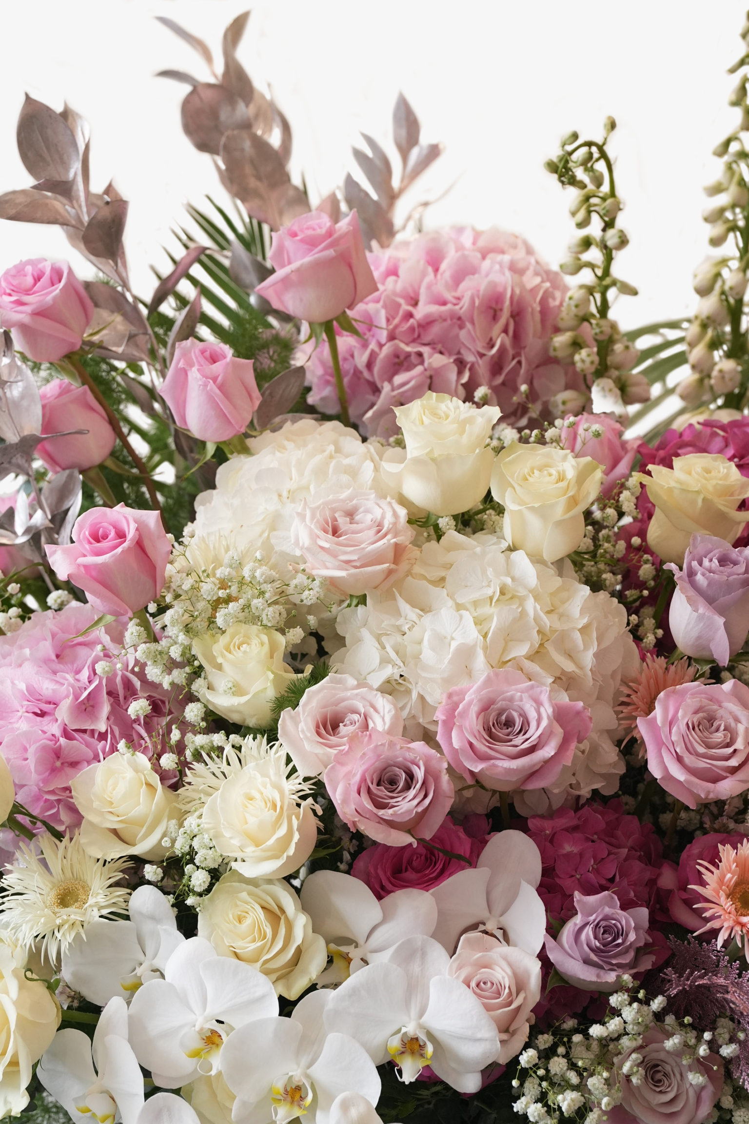 Close-up of Aleah floral stand showing Ecuadorian roses, orchids and Dutch fillers – Just Bloom HK