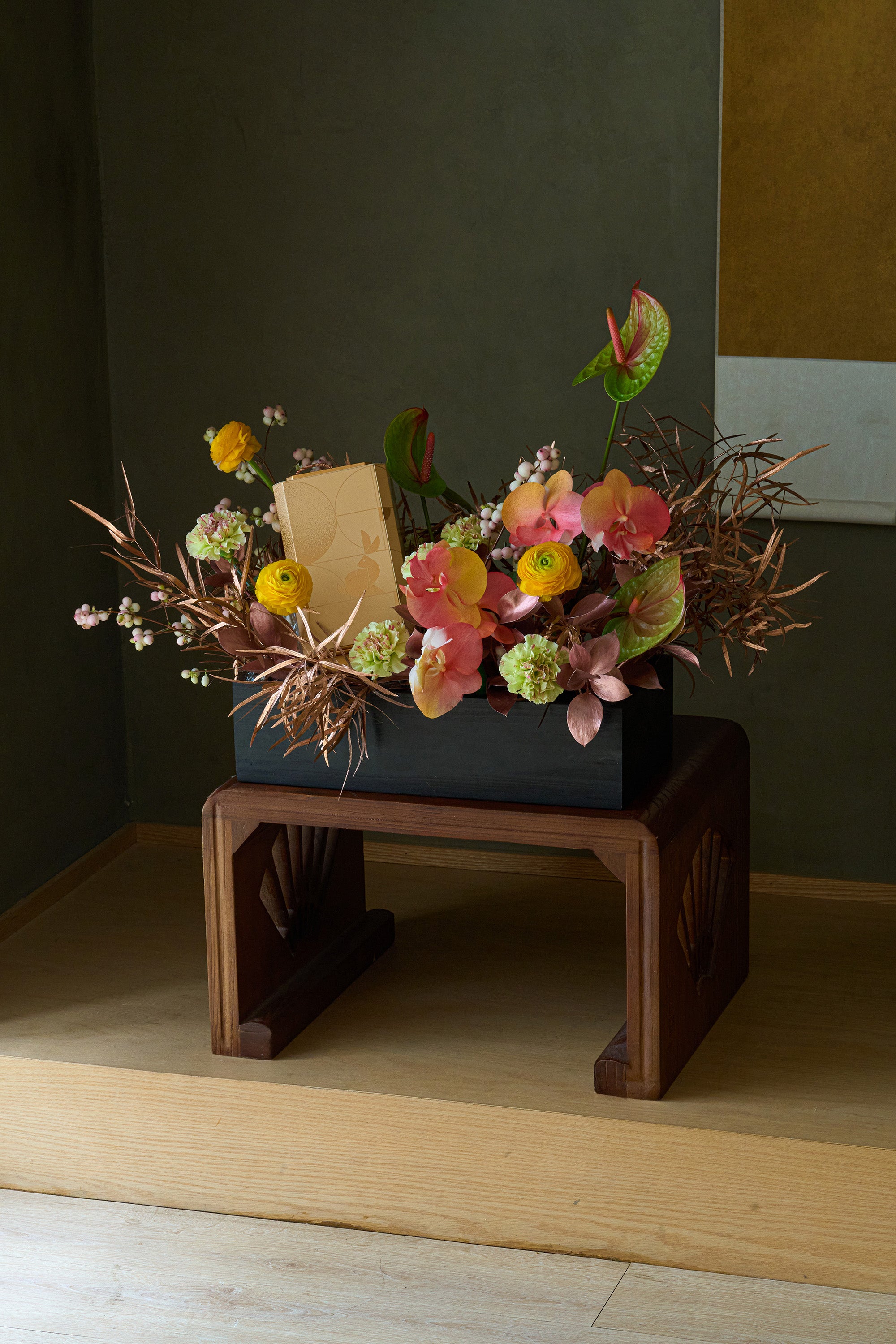 Full view of Just Bloom flower box with chocolate gift set displayed on a wooden side table — Just Bloom Hong Kong
