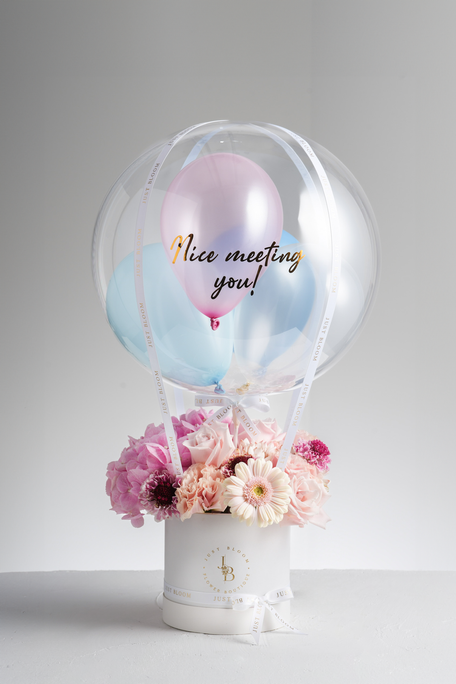 Blaire - A soft pink floral arrangement featuring Ecuadorian roses, hydrangeas, gerberas, carnations, and Dutch chrysanthemums, designed to radiate warmth and joy. Available for same-day delivery in Hong Kong by Just Bloom.