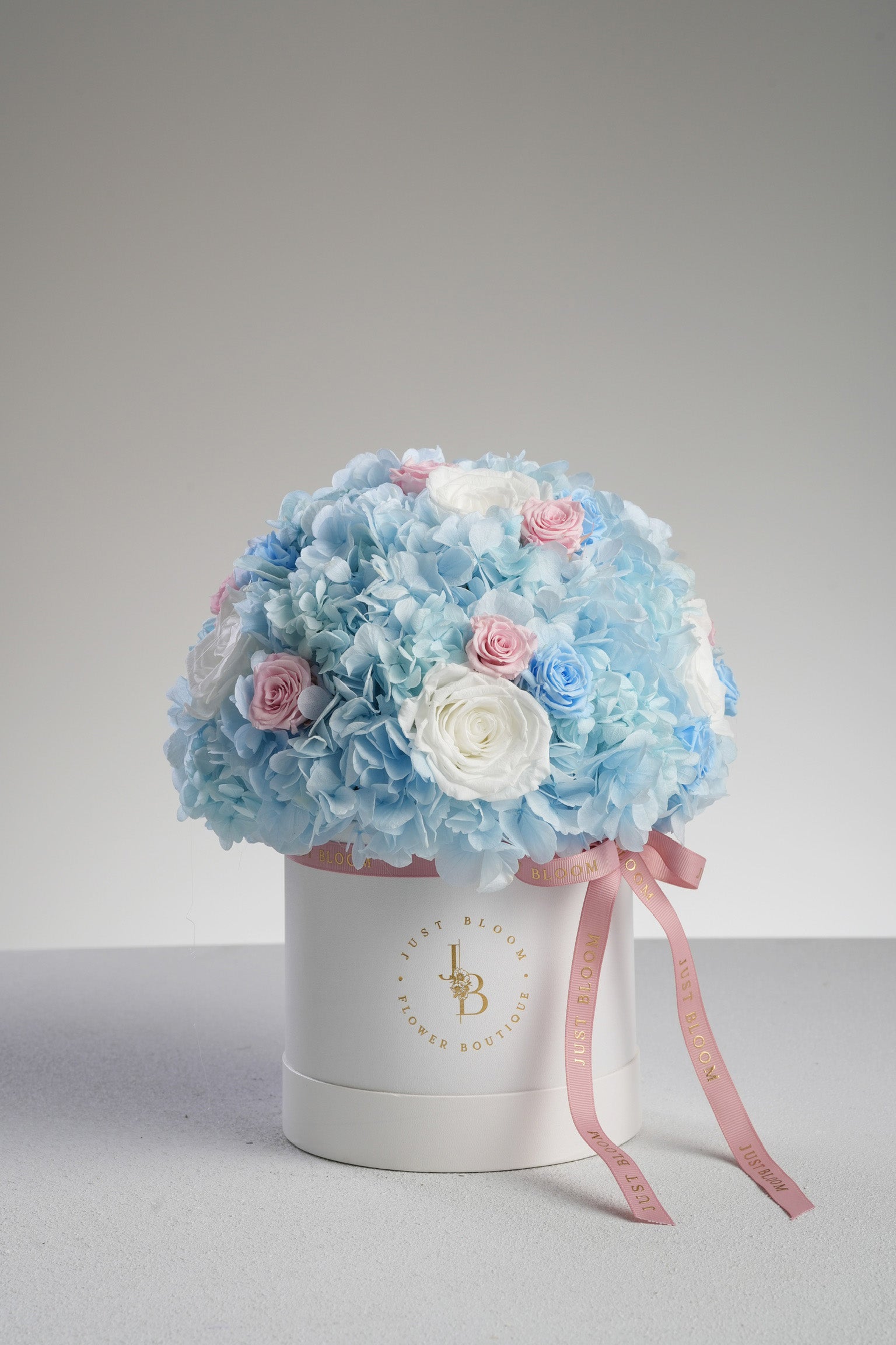 Just Bloom Hong Kong Capri preserved flower box – lifestyle image with added crystal balloon for celebratory effect