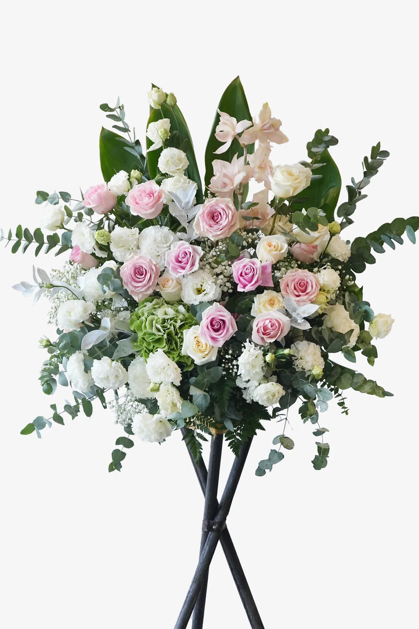 Full view of ‘Celestial Grace’ sympathy flower stand with white and pastel flowers arranged on black tripod