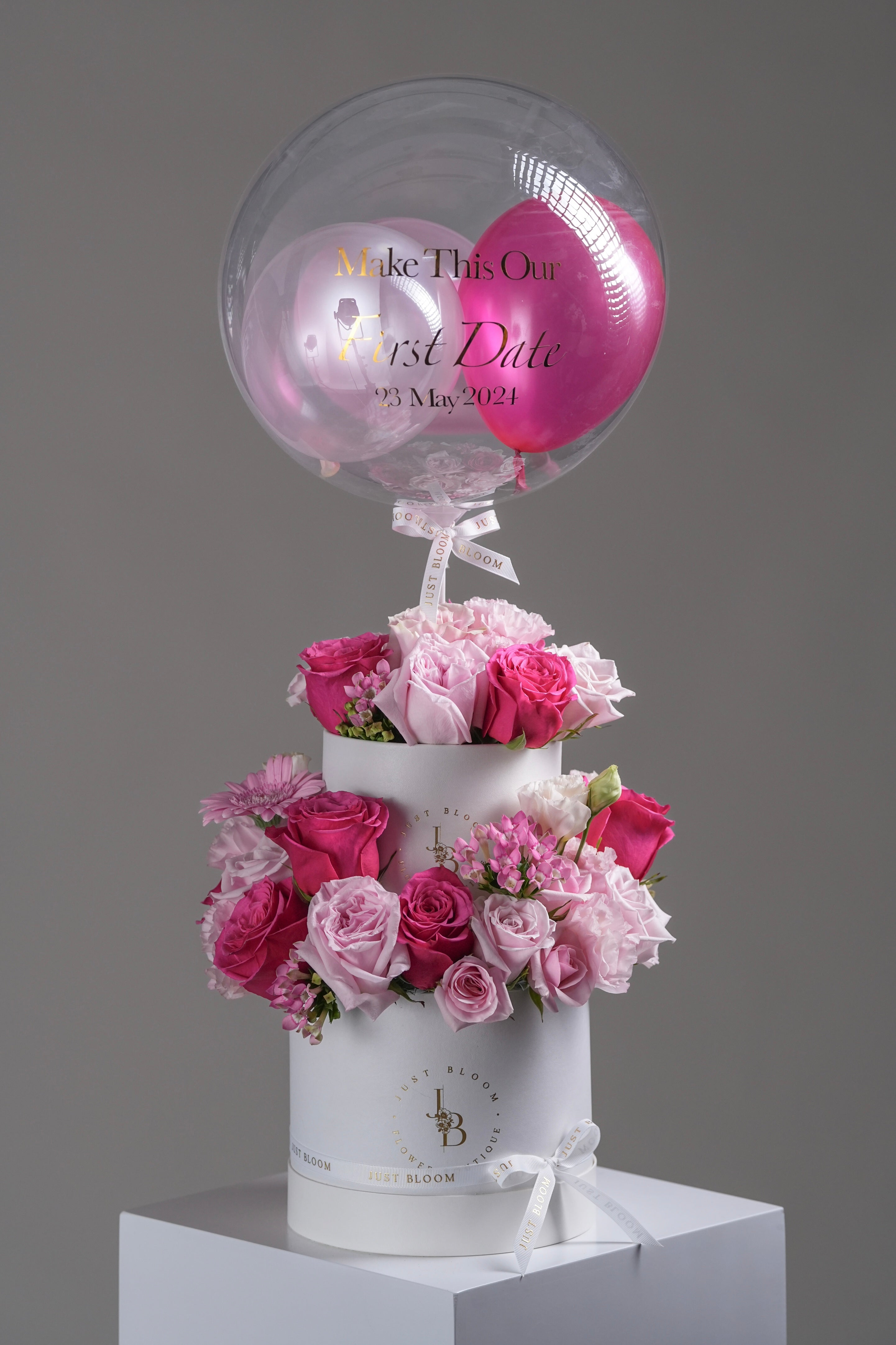 Dolly flower box – two-tier design with pink and fuchsia roses