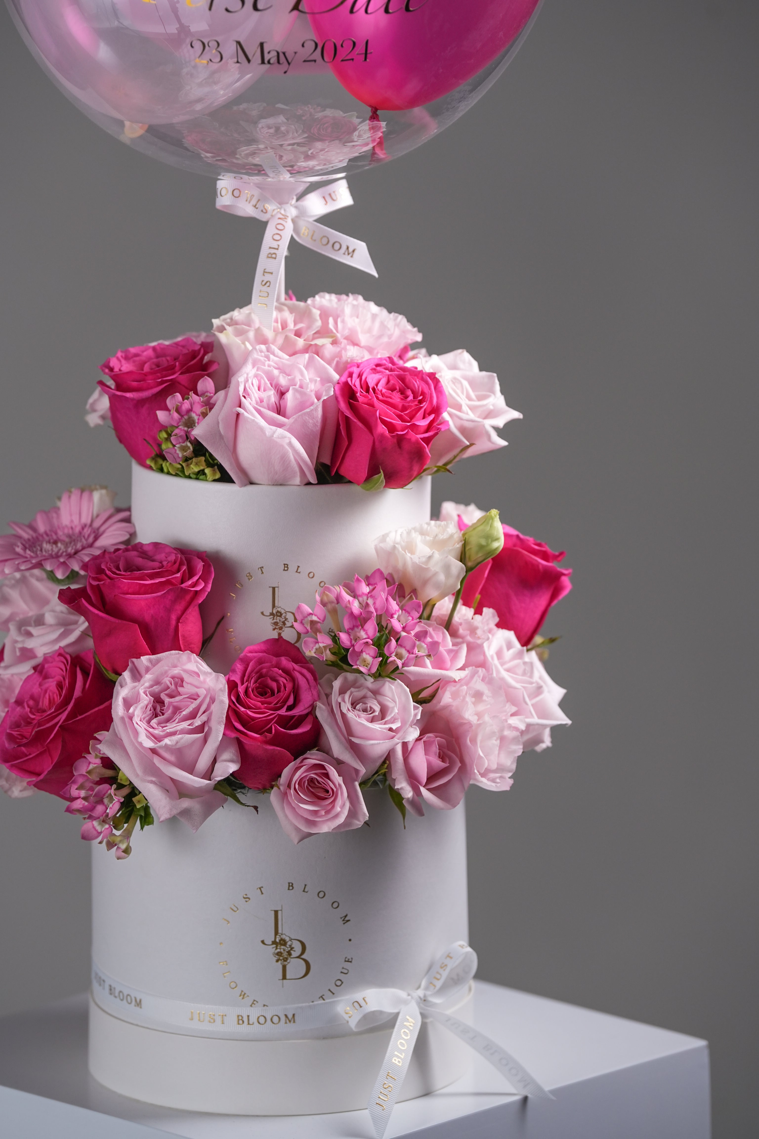 Close-up of Dolly pink flower box in double-layer cake style