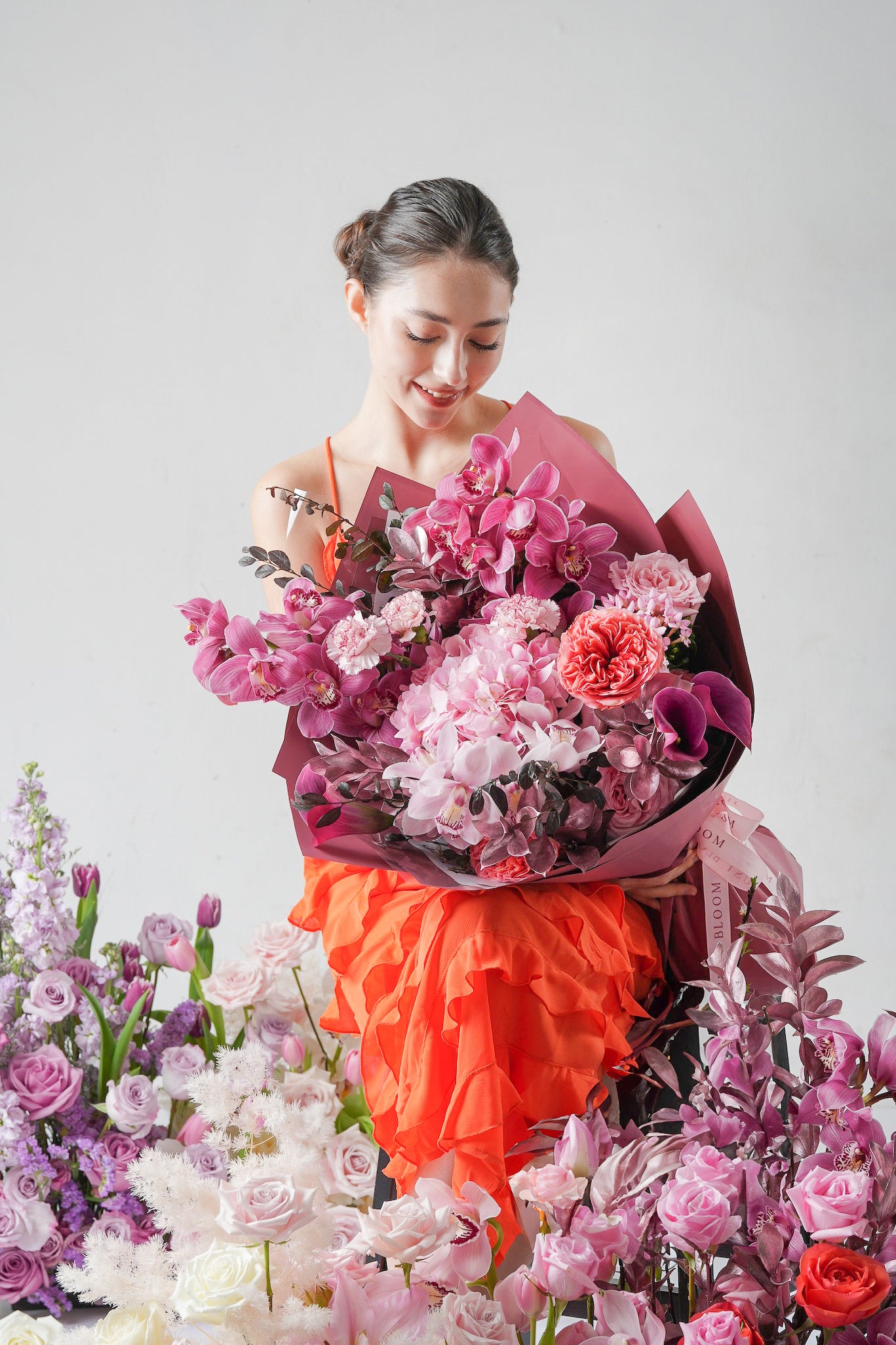 Echoes of Time - A Mother’s Day 2025 floral arrangement featuring purple orchids, pink roses, calla lilies, and coral garden blooms. A bold, elegant tribute to timeless love. Available for same-day delivery in Hong Kong by Just Bloom.