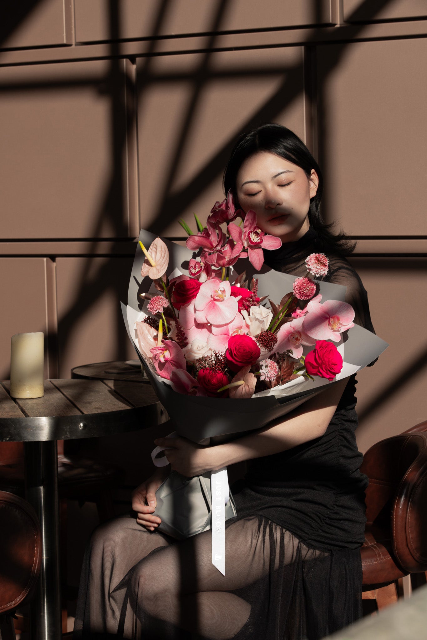 Fierce Love fresh flower bouquet with pink orchids burgundy roses and dramatic textures for Valentine's Day