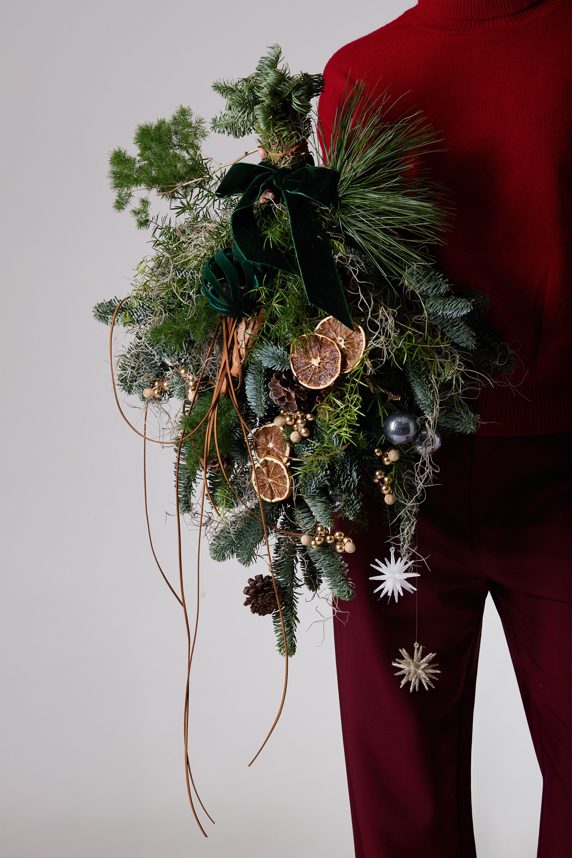 Forest Drift hanging Christmas wreath with evergreens and velvet ribbon