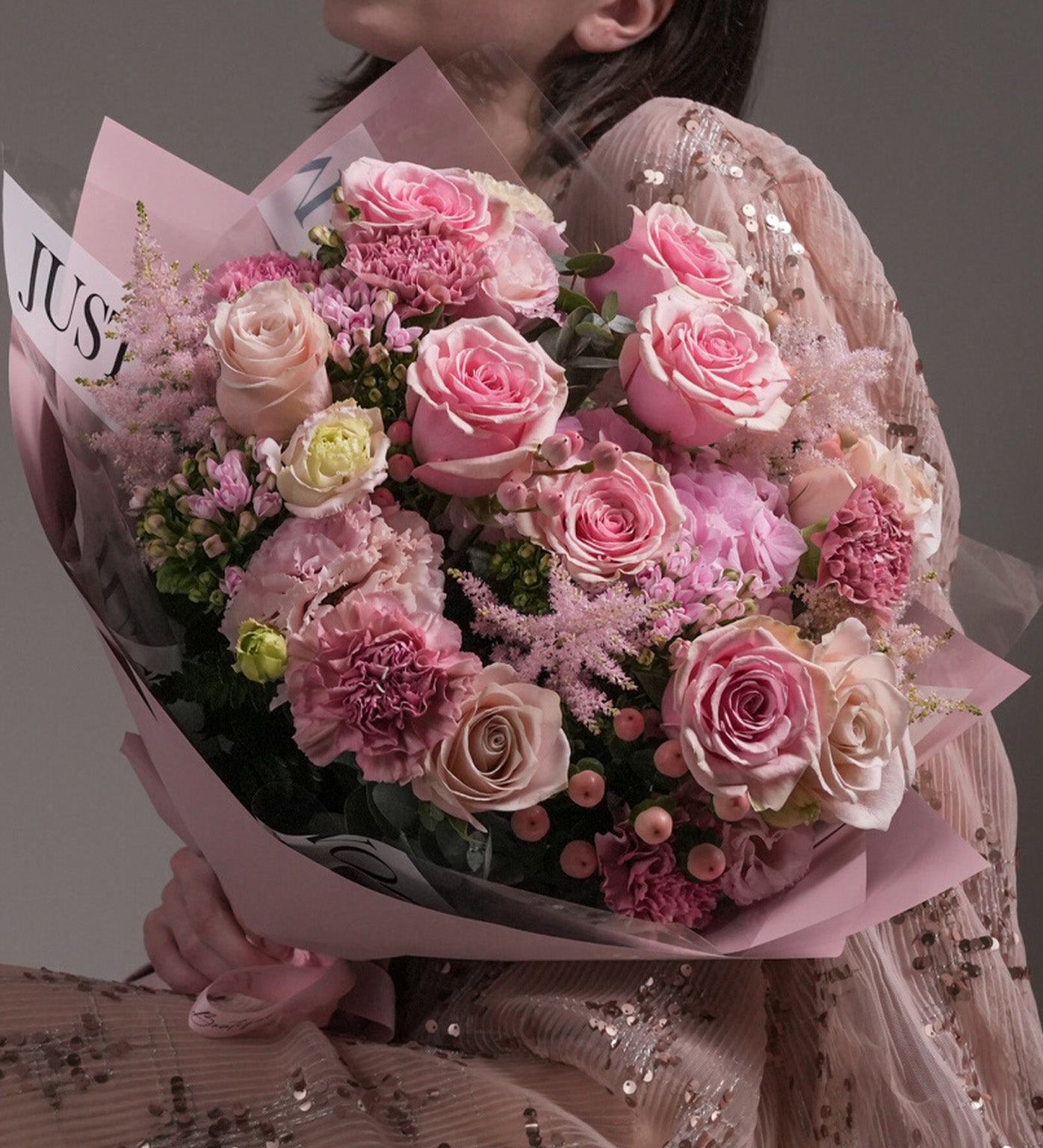 Close-up of Gentle Sweetness bouquet with Ecuadorian roses, astilbes, eustomas and snowberries – Just Bloom HK