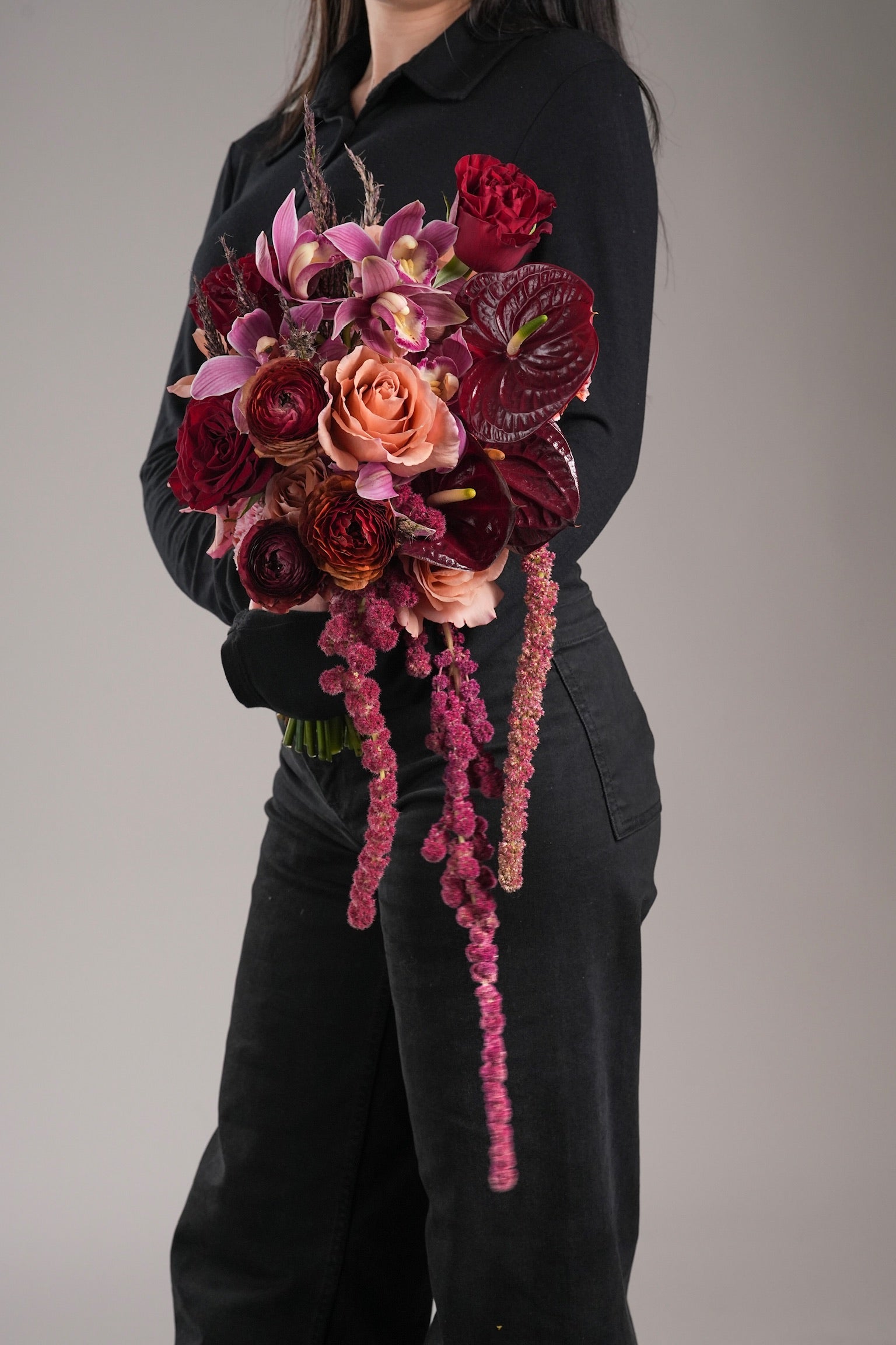 Just Bloom HK Gloria elegant cascading bouquet with garden roses and orchids, held in hand