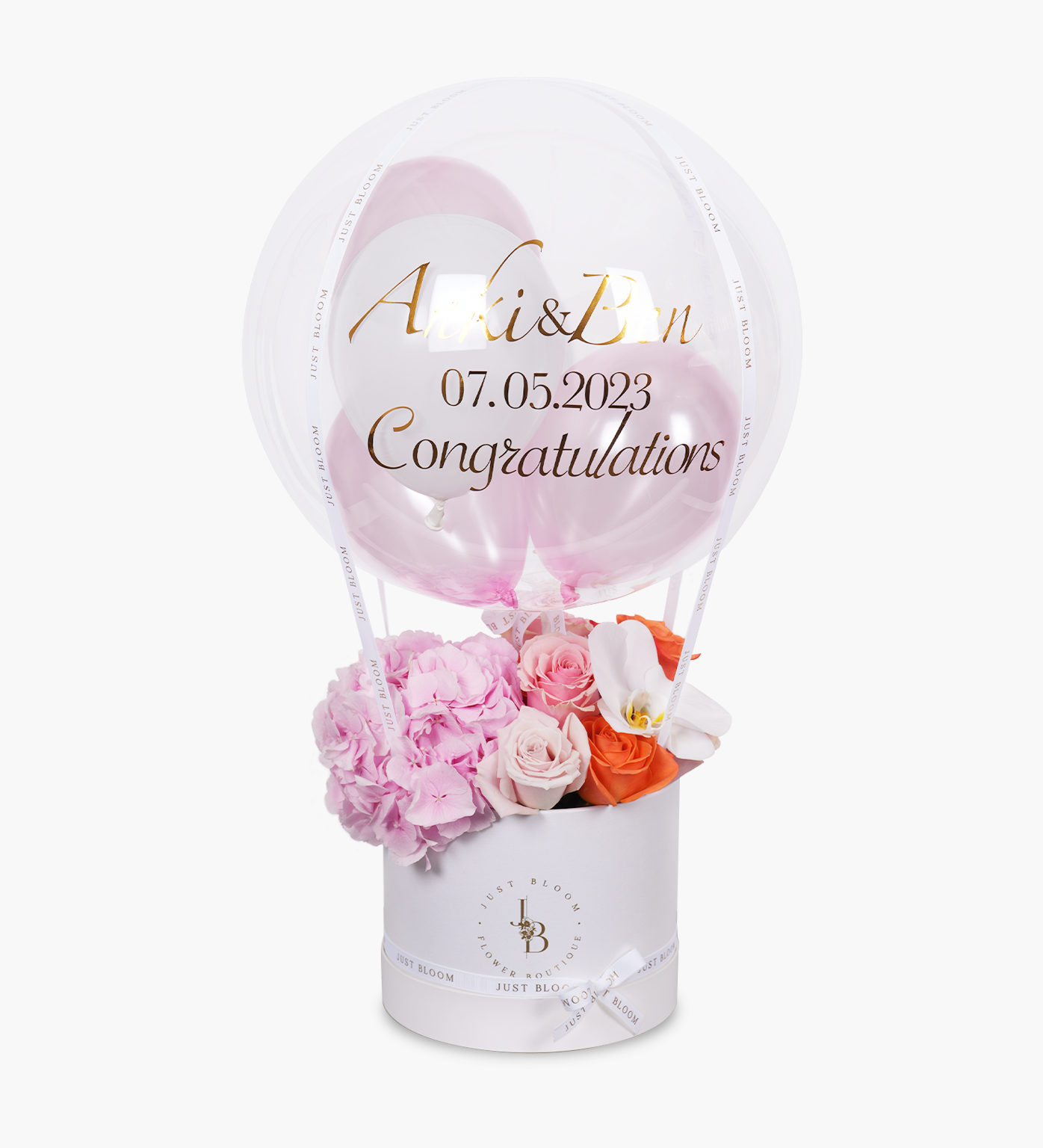 Elegant flower box arrangement in pink and orange tones with roses, hydrangeas, and moth orchids – styled by Just Bloom HK