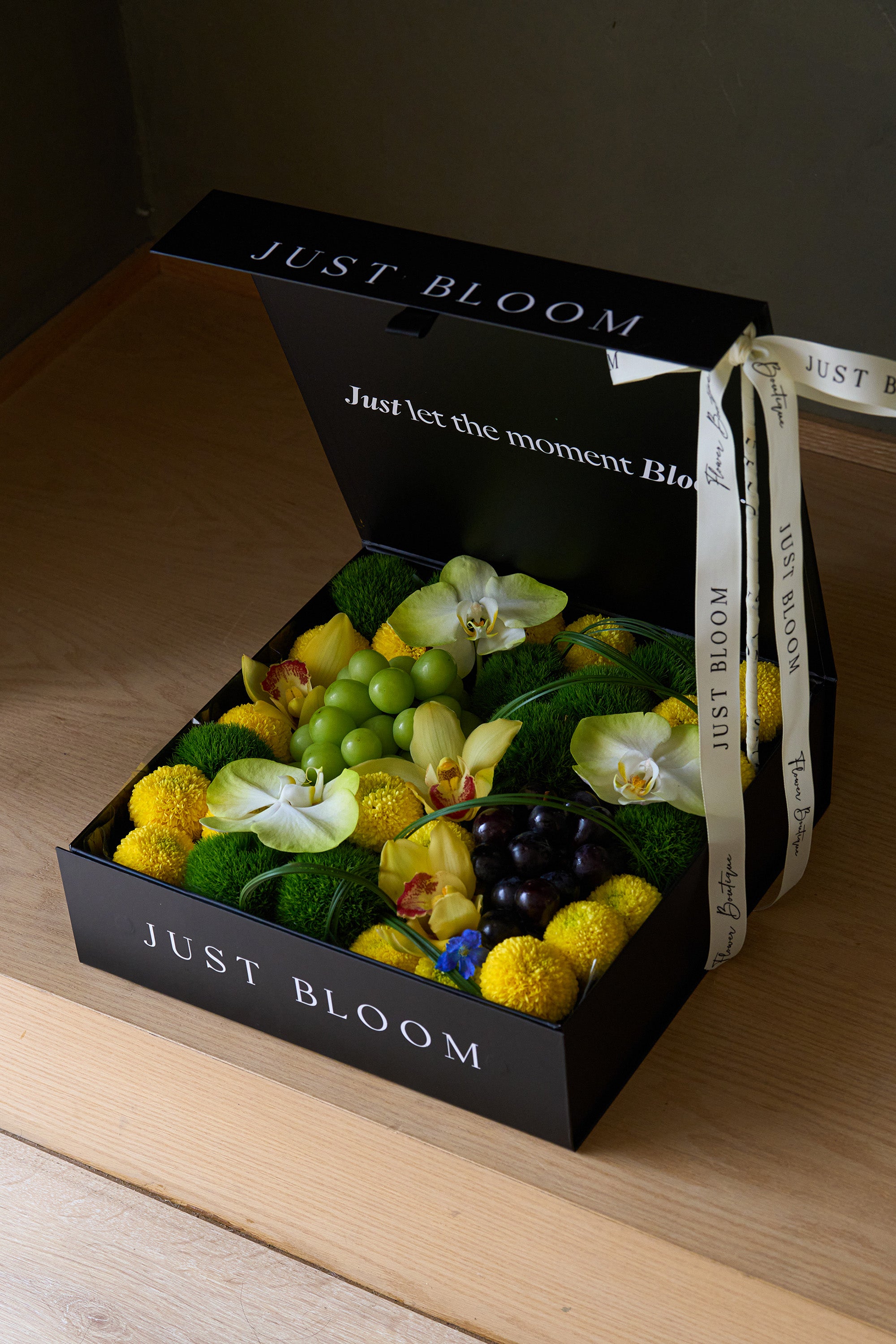 Just Bloom Jade Moon flower box with yellow and green florals and grapes in a black gift box — Just Bloom Hong Kong