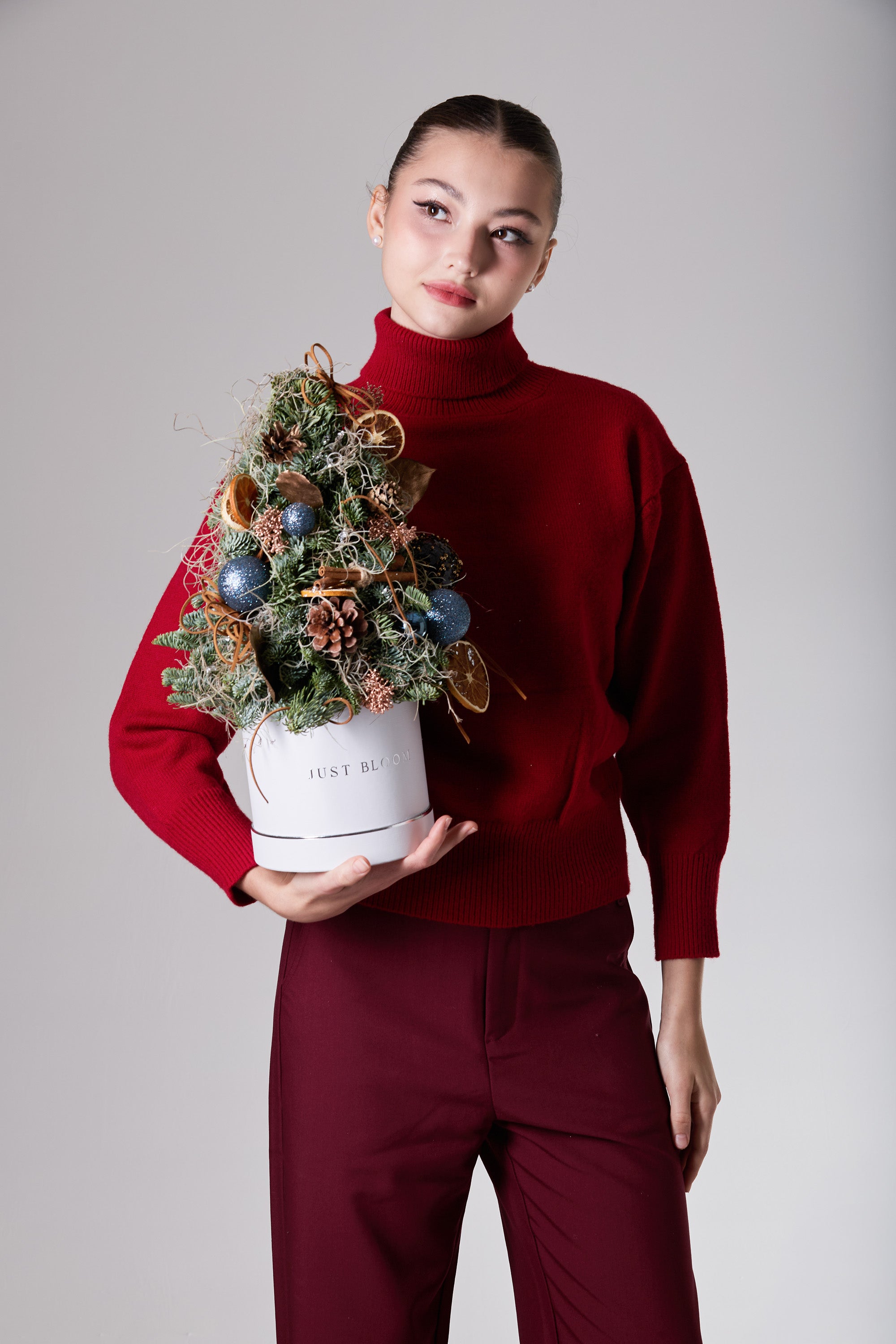 Midnight Frostfall frosted blue festive arrangement with evergreens and cinnamon