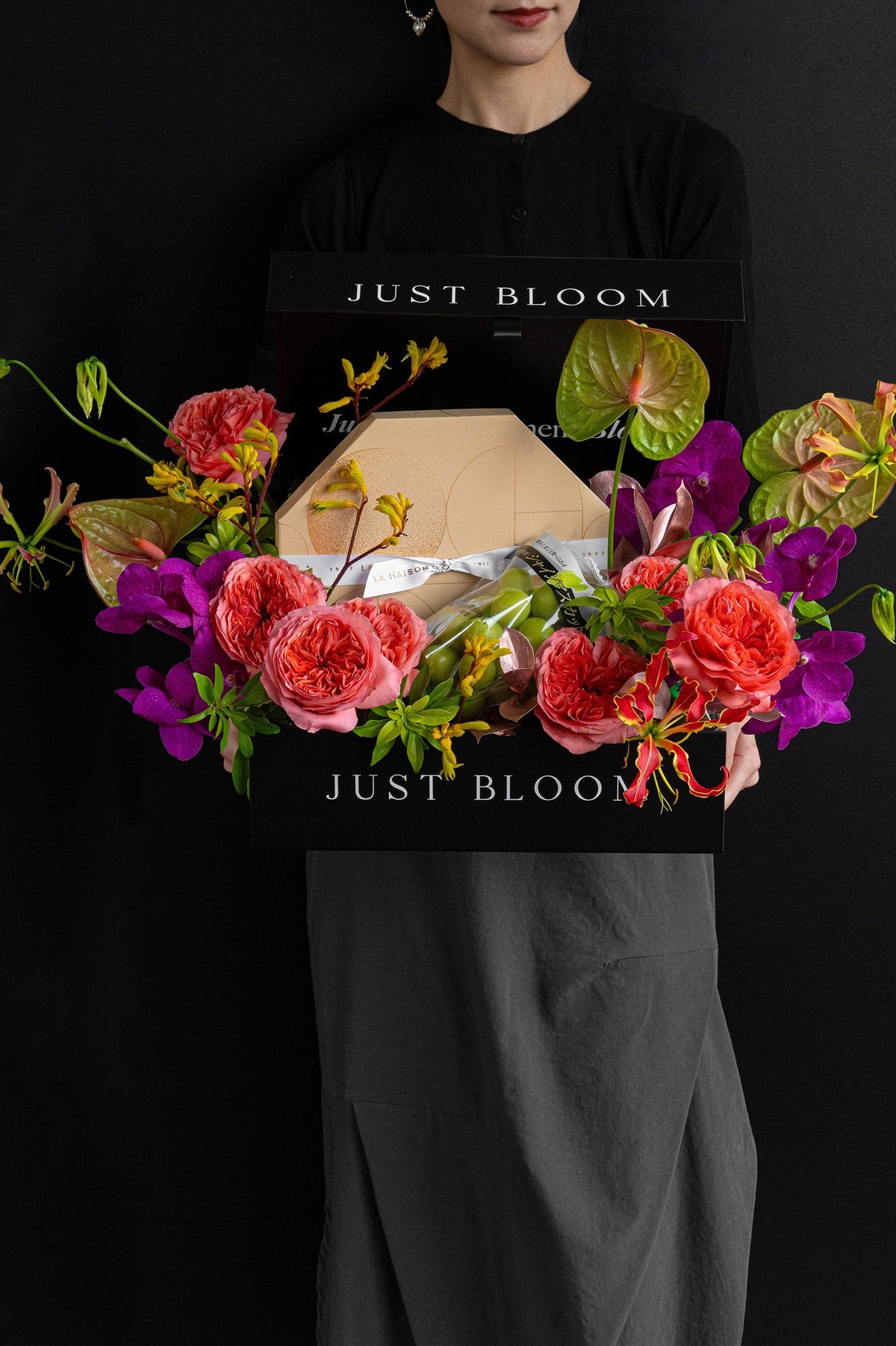 Model holding Just Bloom Moonlit Treasure flower box with coral pink and violet florals and chocolate gift box — Just Bloom Hong Kong