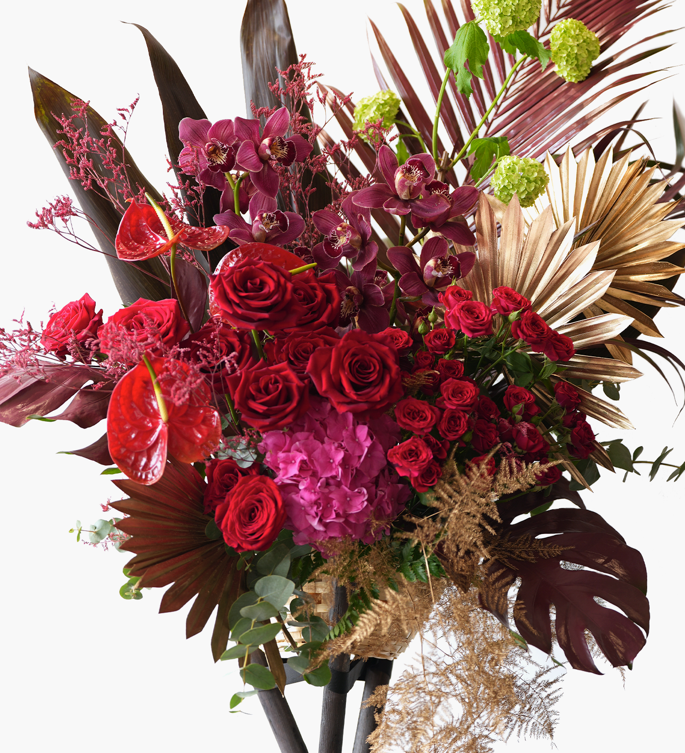 Oakley grand opening stand with burgundy and pink flowers and luxe greenery