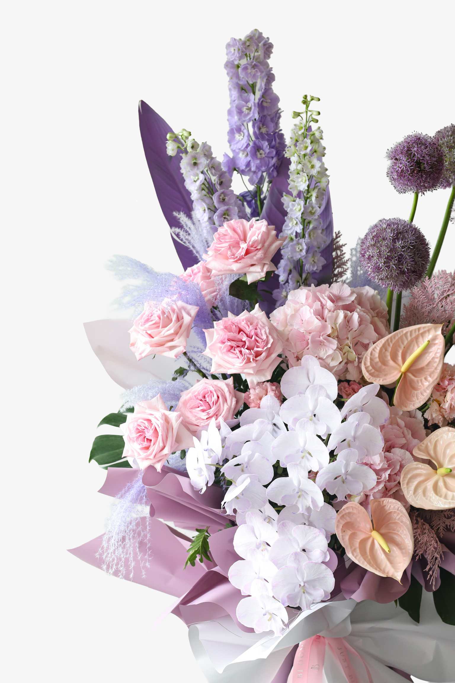 Detail shot of Petal Cloud flower stand by Just Bloom Hong Kong highlighting lavender delphiniums, pink roses, white anthuriums and giant alliums