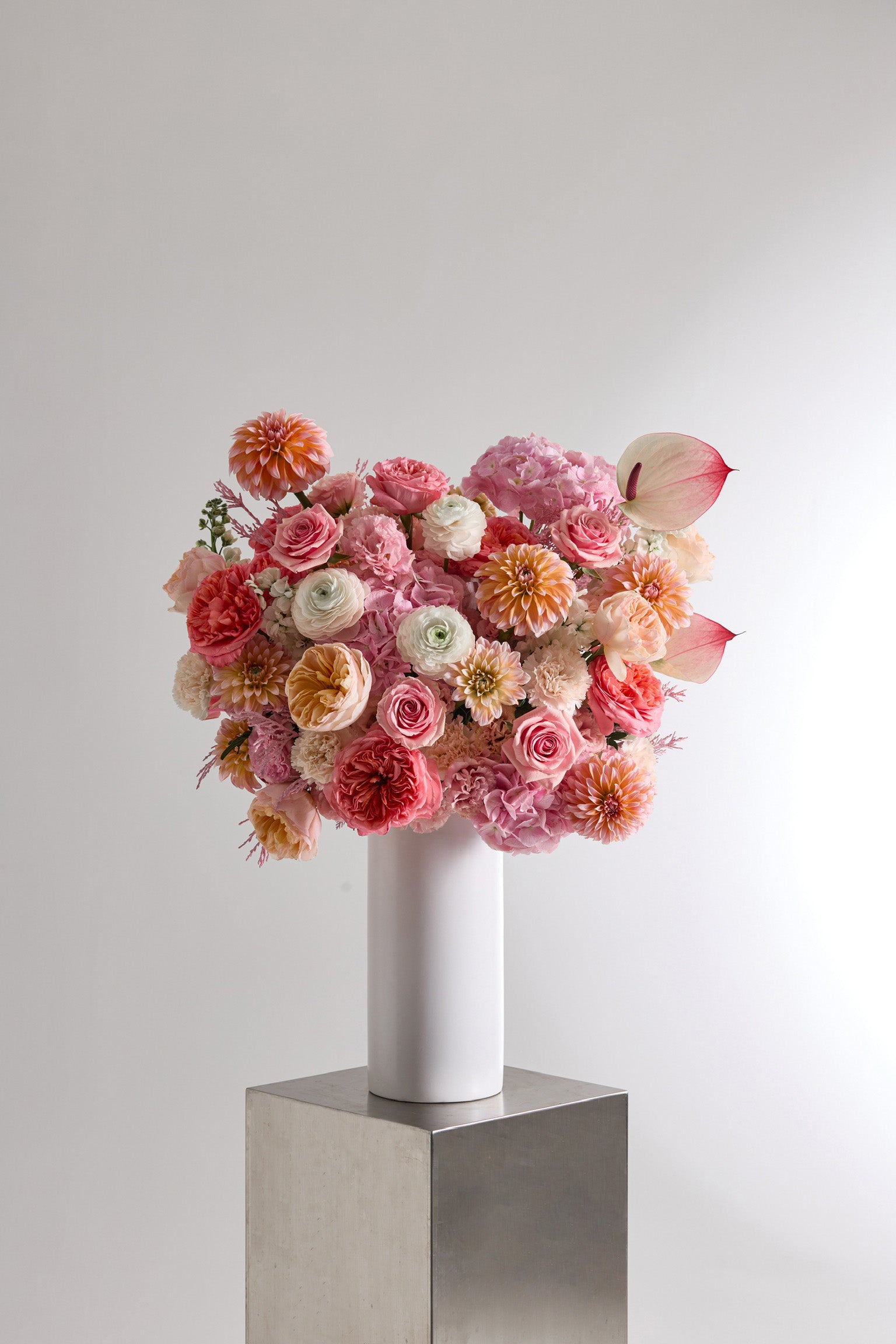Petal Heirloom Vase Arrangement with Soft Peach and Pink Garden Roses, Dahlias, Ranunculuses, Hydrangeas, Stock, Anthuriums, Eustomas, Carnations, and Tinted Foliage by Just Bloom Hong Kong