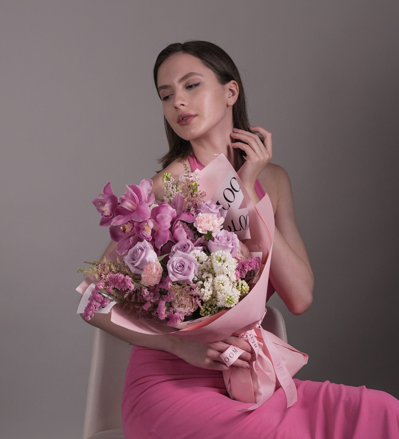 Pink Embrace bouquet with pink roses, cymbidium orchids, lilac, and astilbes