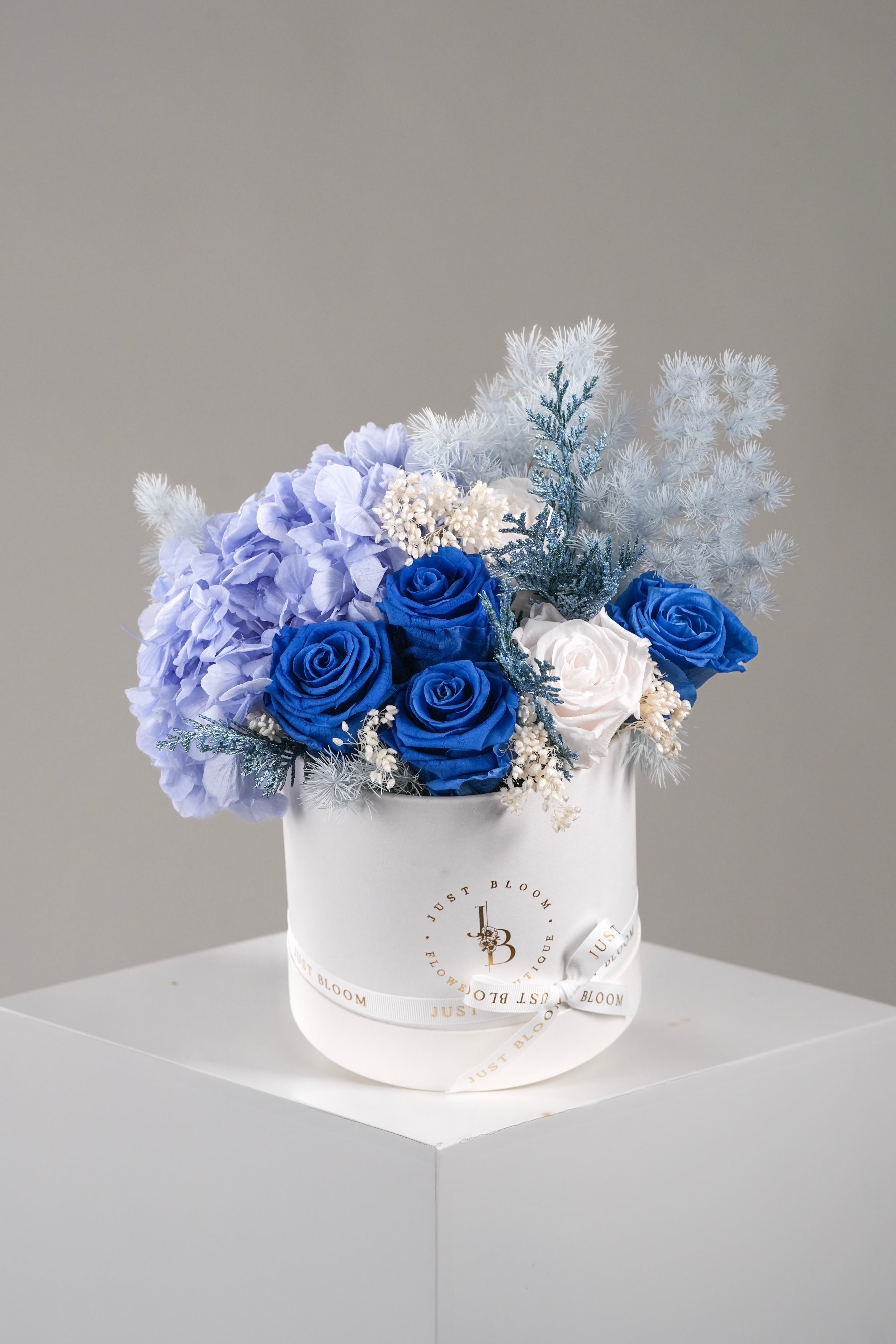 Selene preserved flower box with blue roses, hydrangeas, and delicate fillers