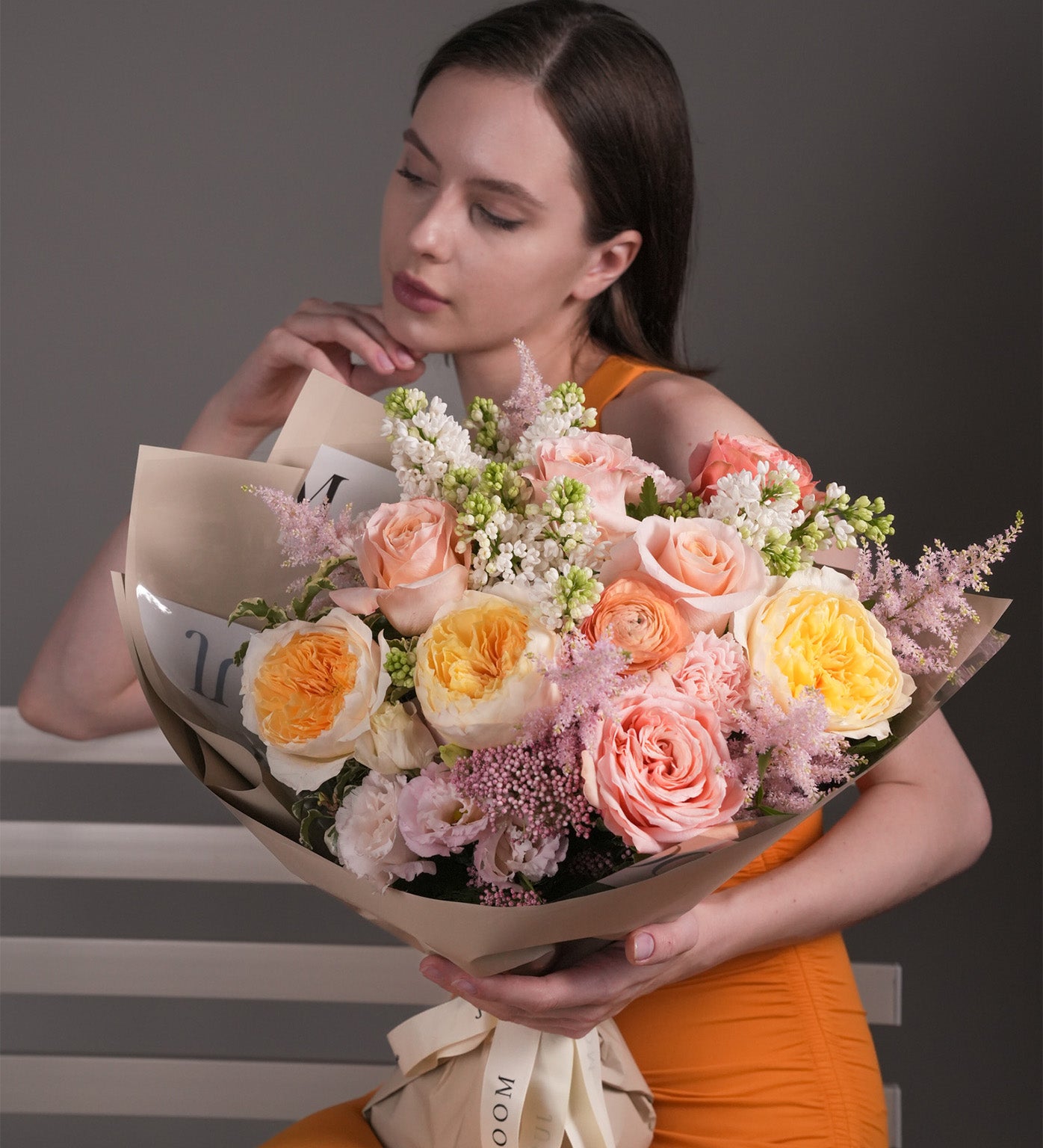 Spring Serenade bouquet with Ecuadorian roses, David Austin Juliet garden roses, stocks, and pastel Dutch blooms