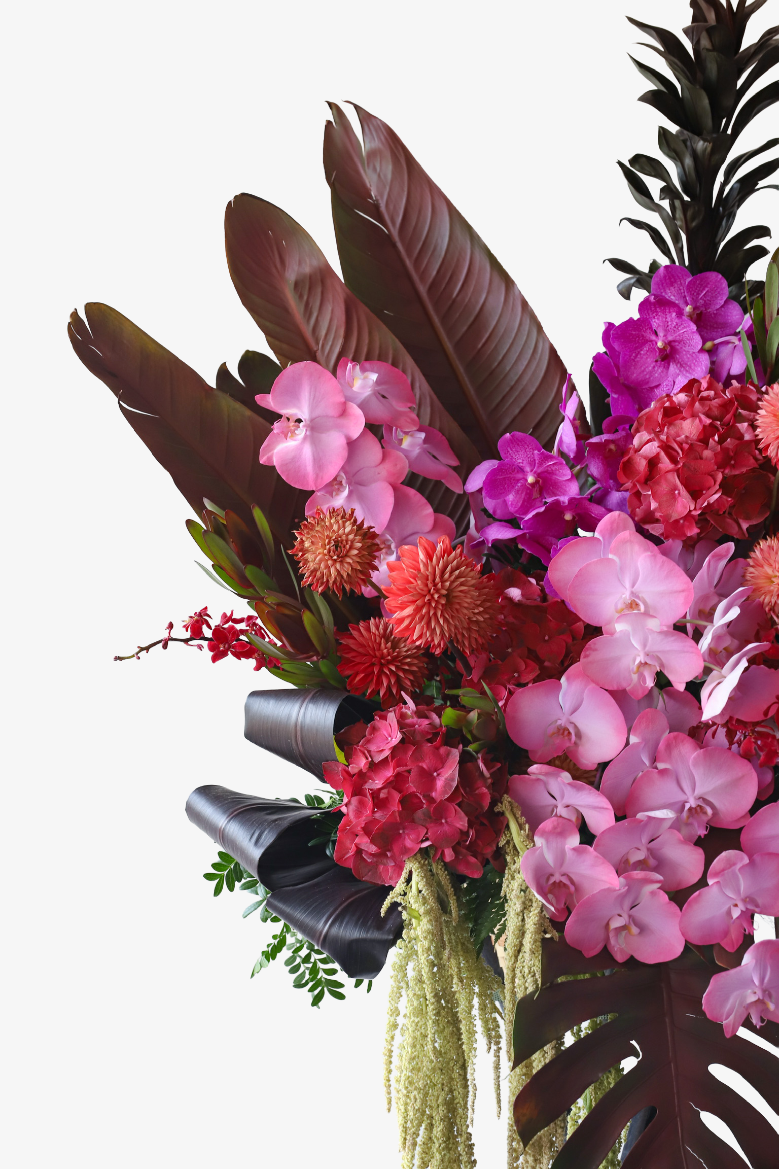 Detail shot of Tropical Fire flower stand by Just Bloom Hong Kong highlighting deep burgundy tropical leaves, fuchsia vanda orchids and coral dahlias