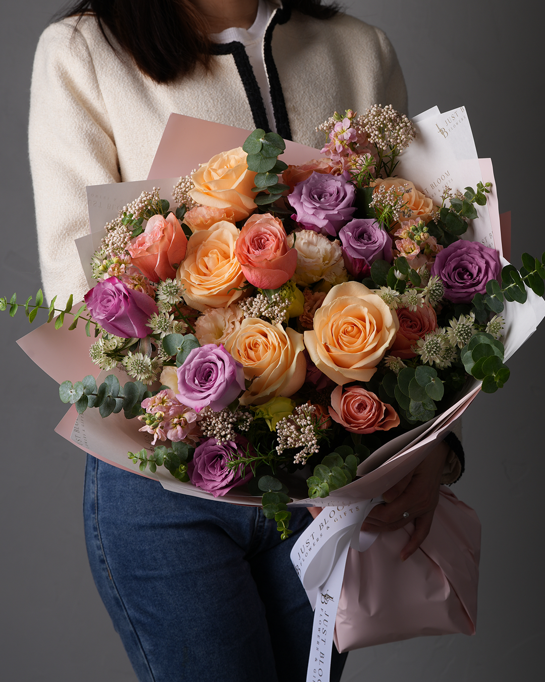 Hand-tied pastel flower bouquet with peach roses, lilac eustomas, and eucalyptus – romantic gift by Just Bloom Hong Kong