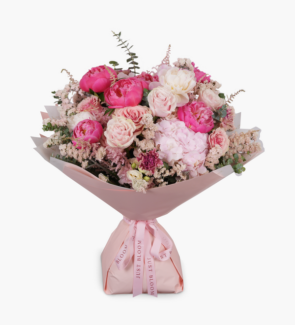 Pink rose, peony, hydrangea, astilbe, carnation, filler and eucalyptus bouquet