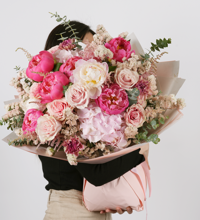 Pink rose, peony, hydrangea, astilbe, carnation, filler and eucalyptus bouquet
