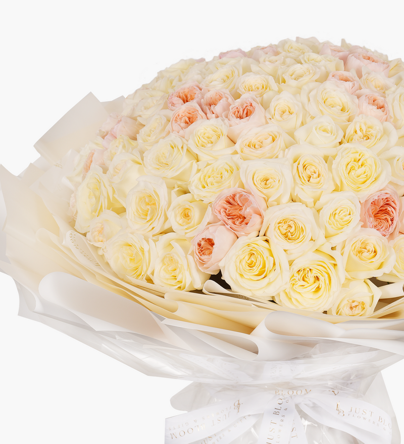 White garden and David Austin Juliet roses bouquet with a total of 99 stems