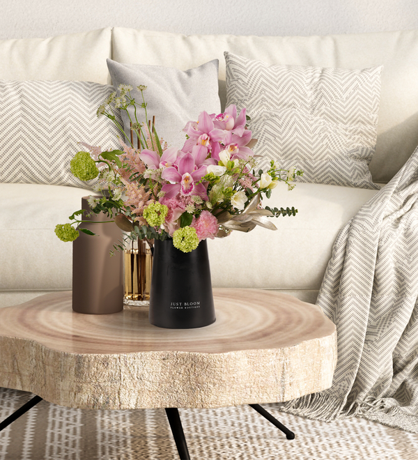 Fresh vase arrangements by Just bloom × Hong Kong Florist, featuring a mesmerizing fusion of Ecuadorian hydrangeas and exquisite Dutch greenery, showcased in a sleek black vase, with powder green tones surrounding the arrangement.