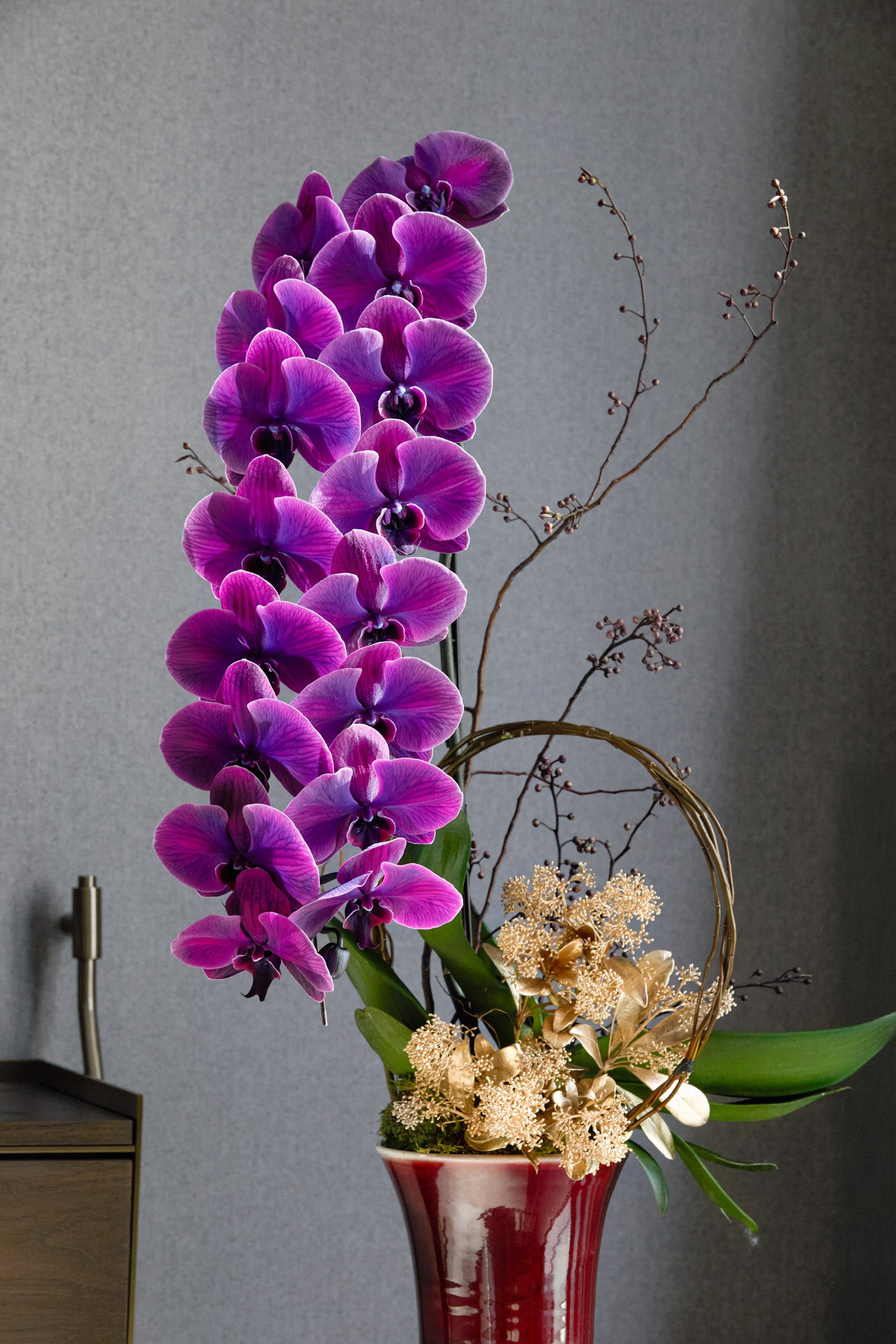 Year of the Horse elegant single-stem purple orchid with architectural gold circle Chinese New Year minimalist arrangement