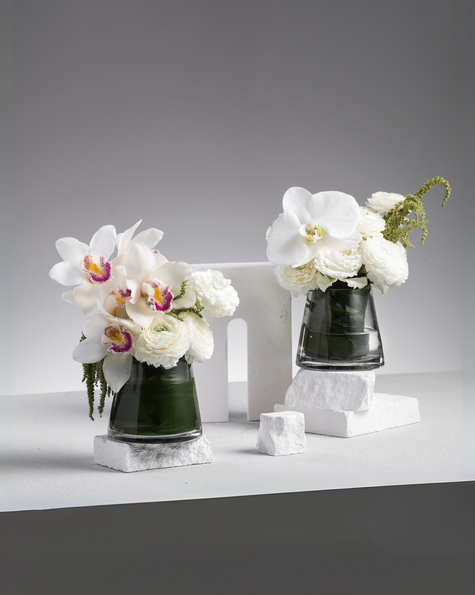 Allyson Vase Arrangement with White Phalaenopsis Orchids, Ranunculuses, Eustomas, and Amaranthus Caudatus by Just Bloom Hong Kong