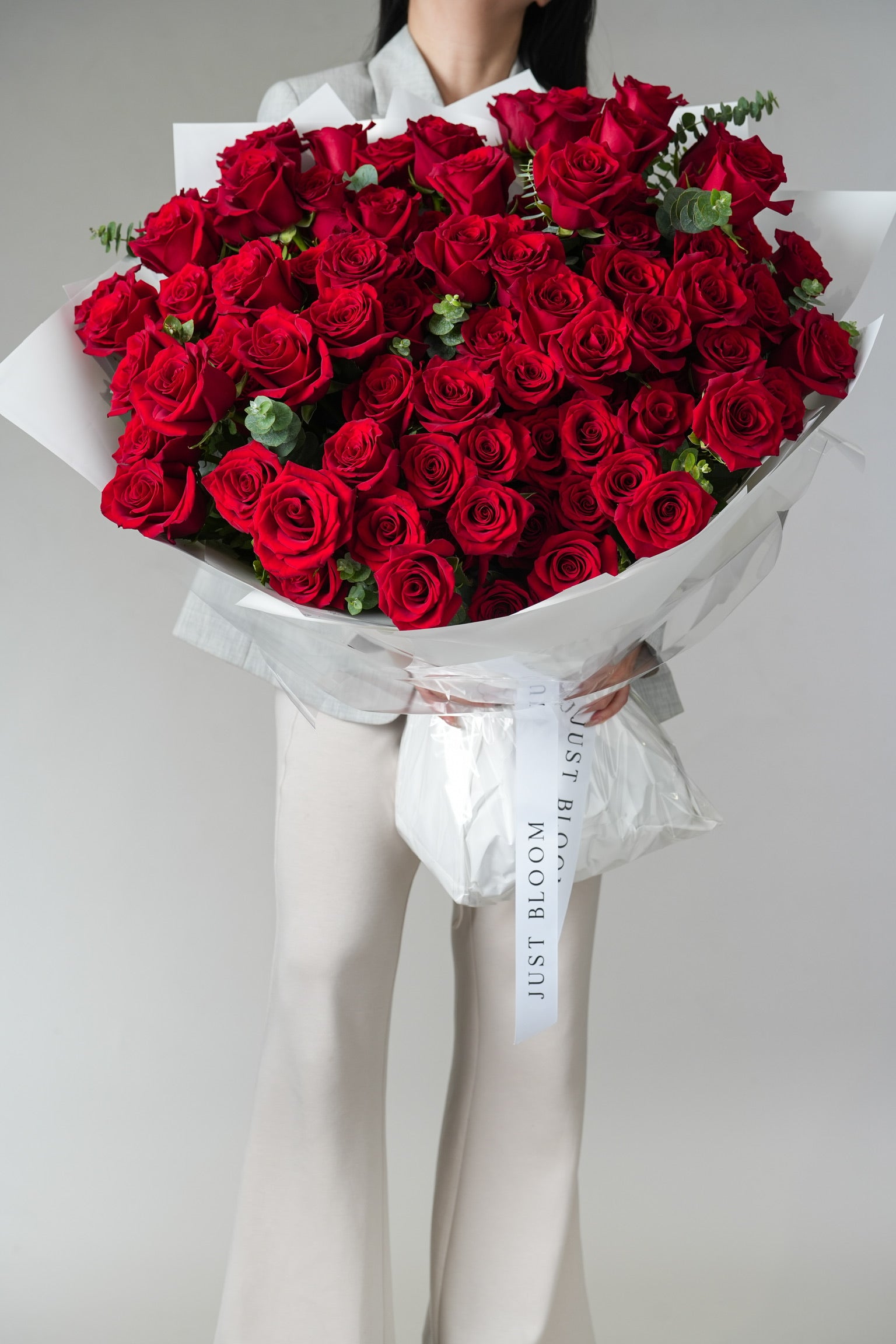 Amour Rouge bouquet with 99 premium Ecuadorian red roses and greenery