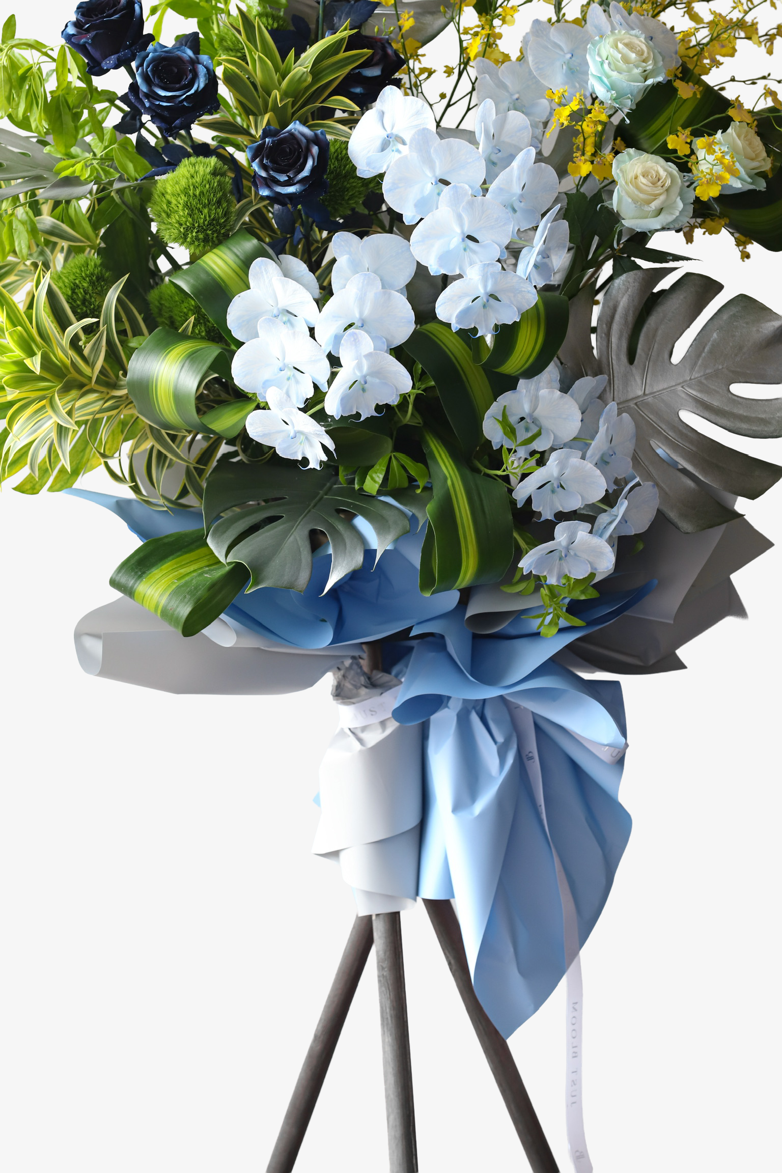 Detail shot of Blue Horizon flower stand by Just Bloom Hong Kong highlighting white phalaenopsis orchids, deep navy roses and powder blue bow wrapping
