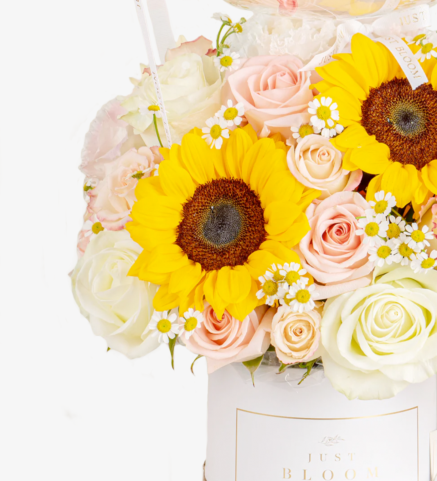 Close-up of Emilia floral arrangement showing sunflowers, chamomiles and eustomas