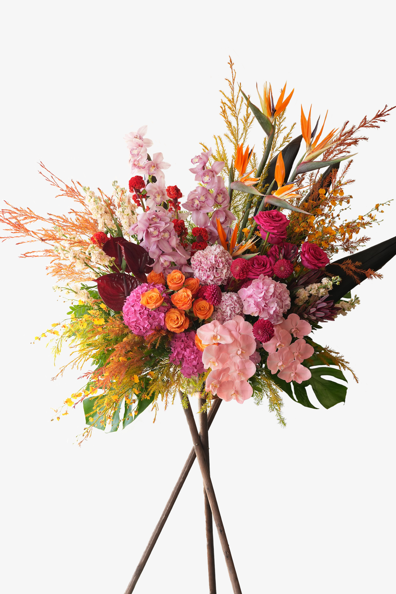 Euphoria grand opening flower stand with phalaenopsis orchids, roses, hydrangeas, birds of paradise, and anthuriums in bold pink, orange and red