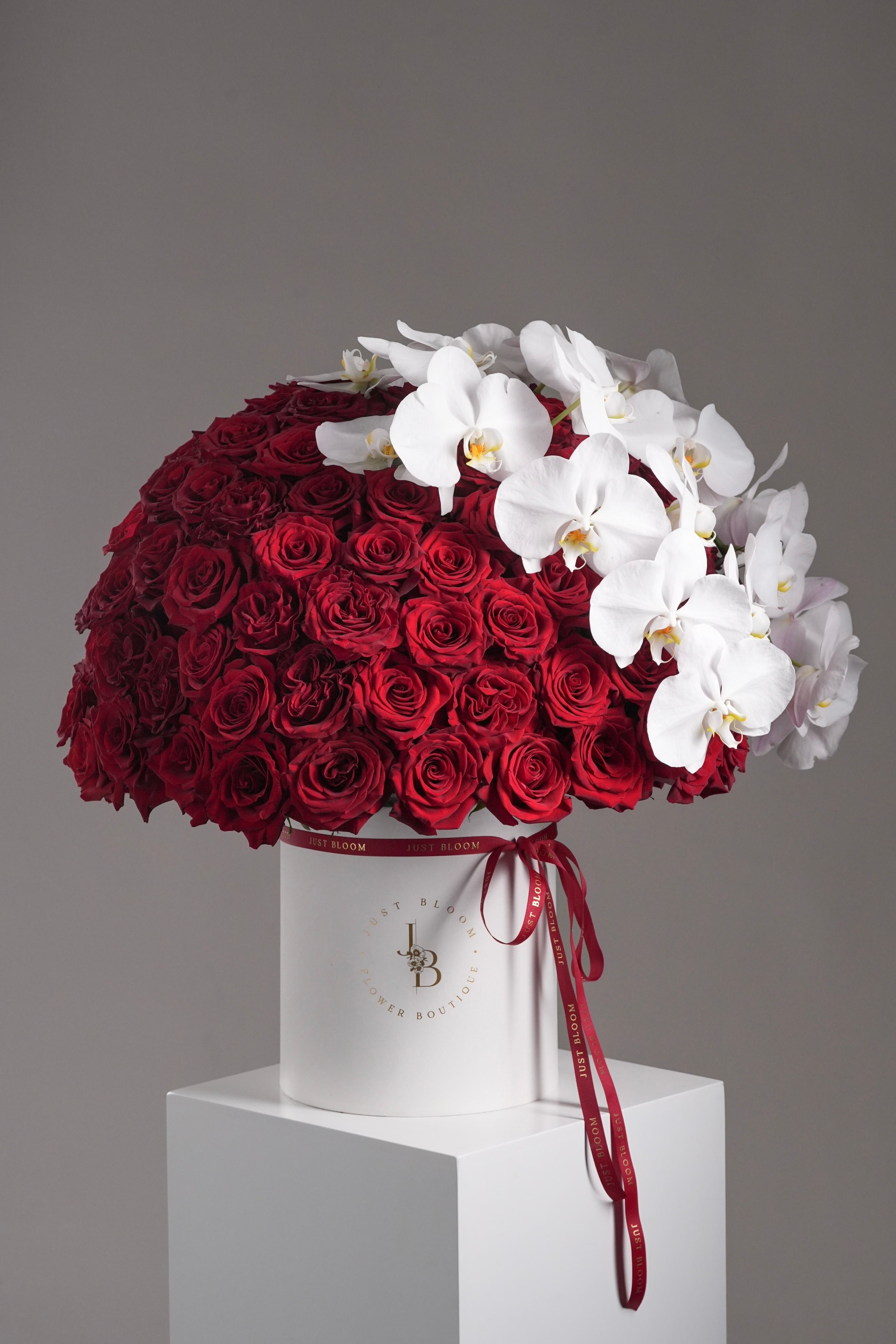 Just Bloom Faith 99-stem Ecuadorian red rose and orchid flower box – luxury romantic floral gift