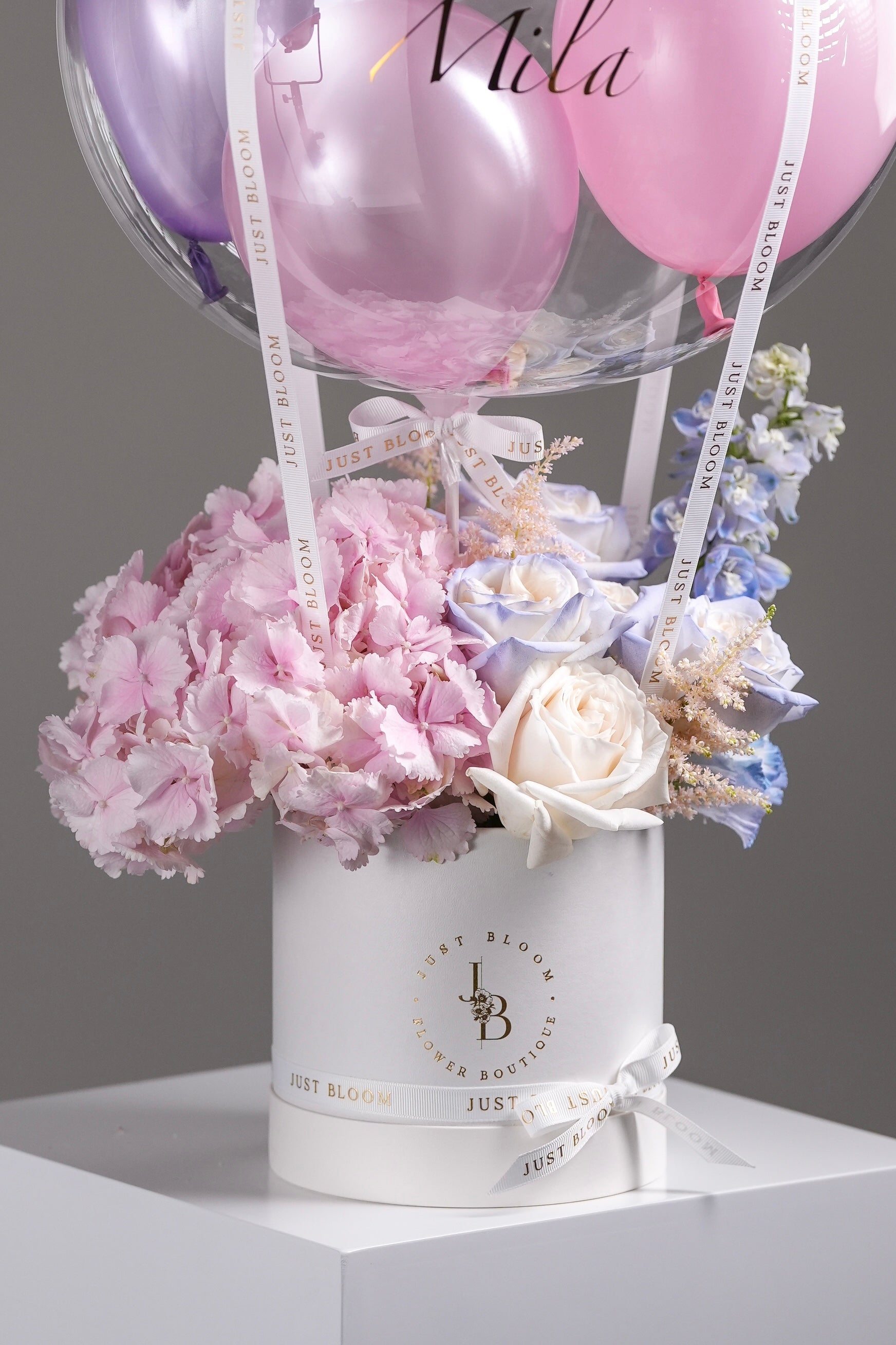 Close-up of Freya flower box showing detailed pink hydrangeas and ribbon with brand logo – Just Bloom Hong Kong