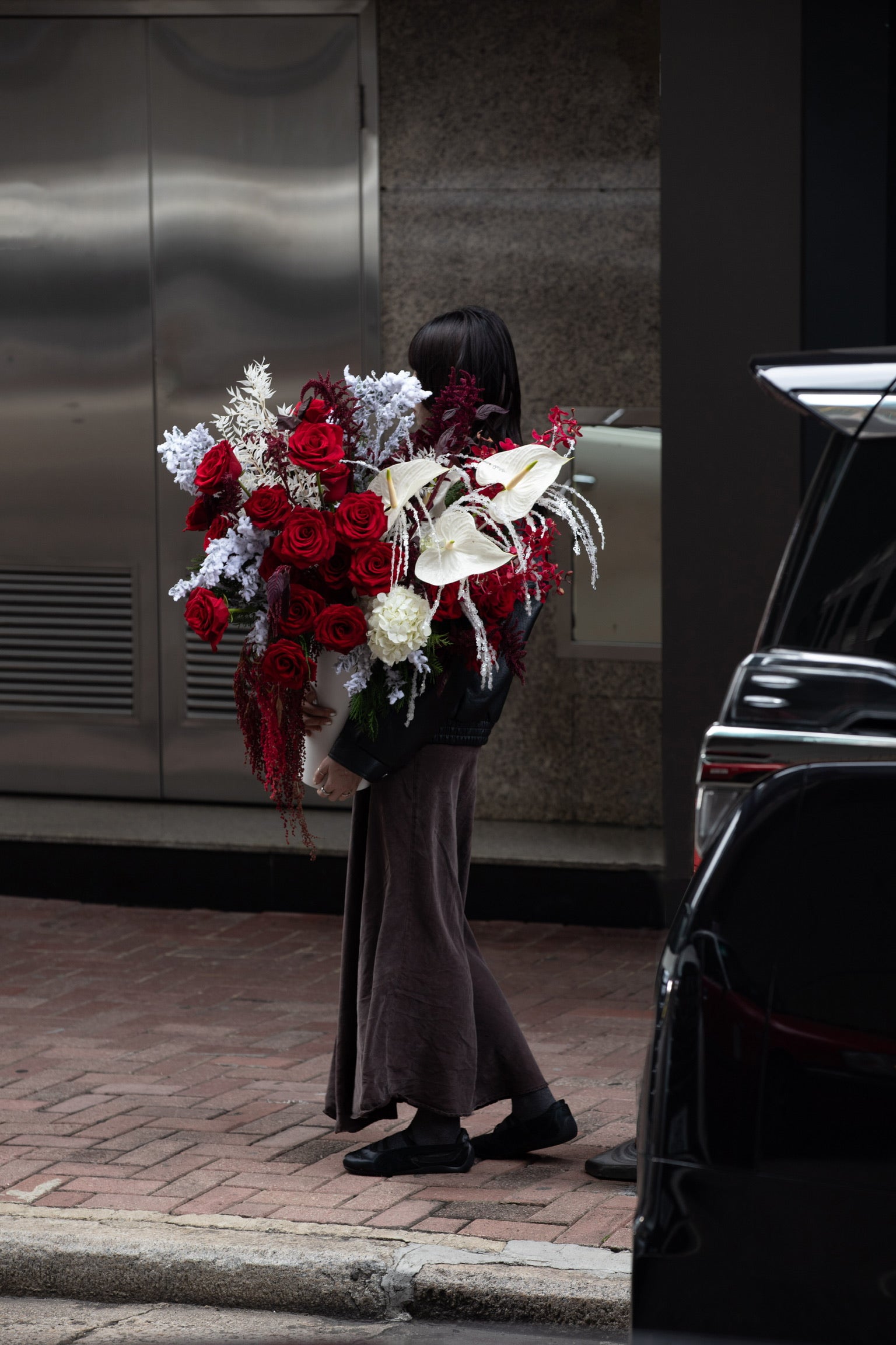 Frosted Crimson Christmas vase arrangement with red roses and white anthuriums