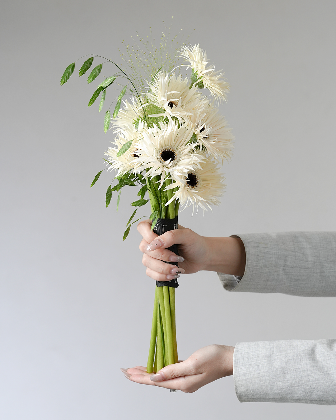 Ivory Whisper bridal bouquet with white gerberas and greenery