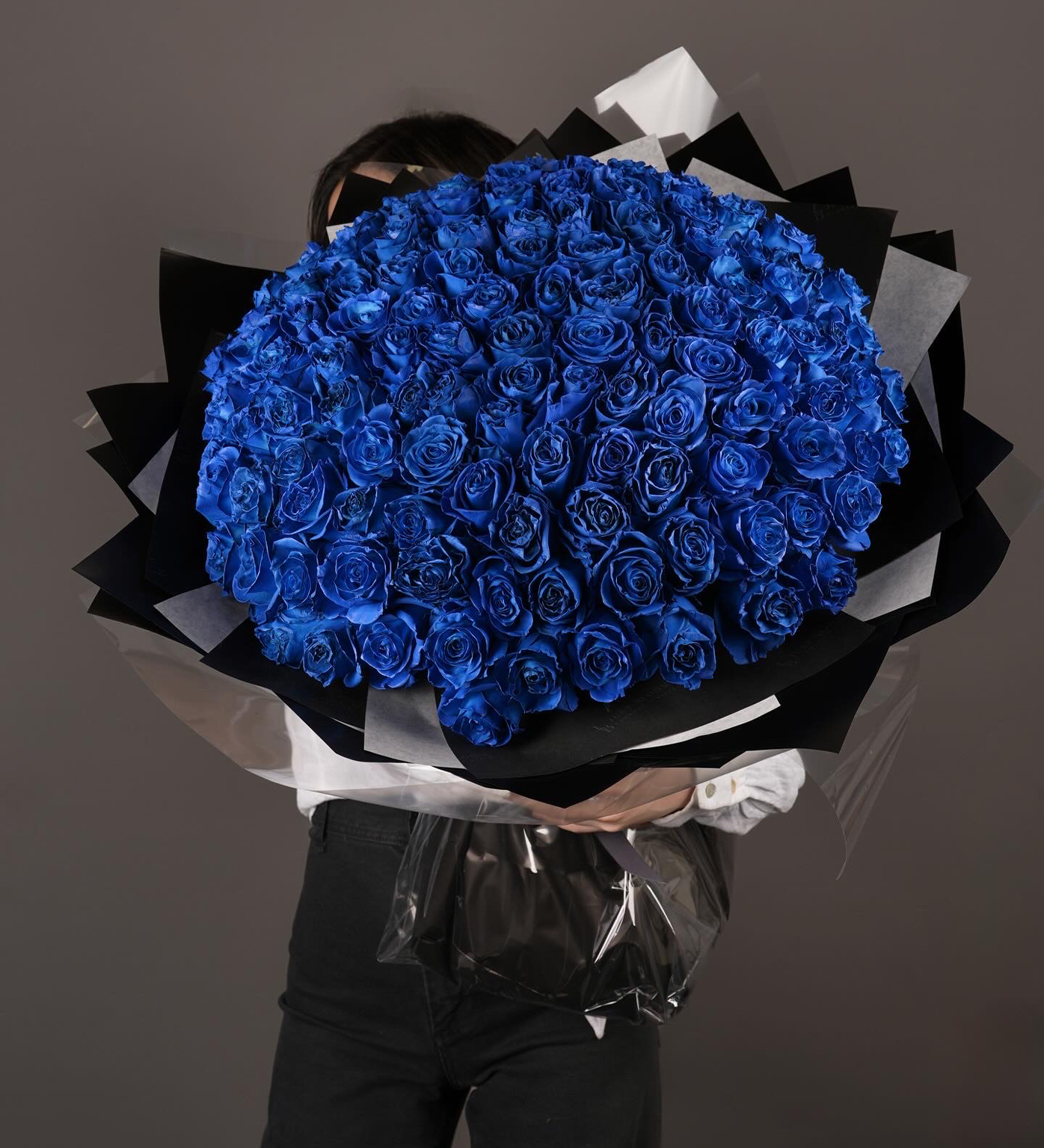 Close-up of bright blue roses in luxury wrapping