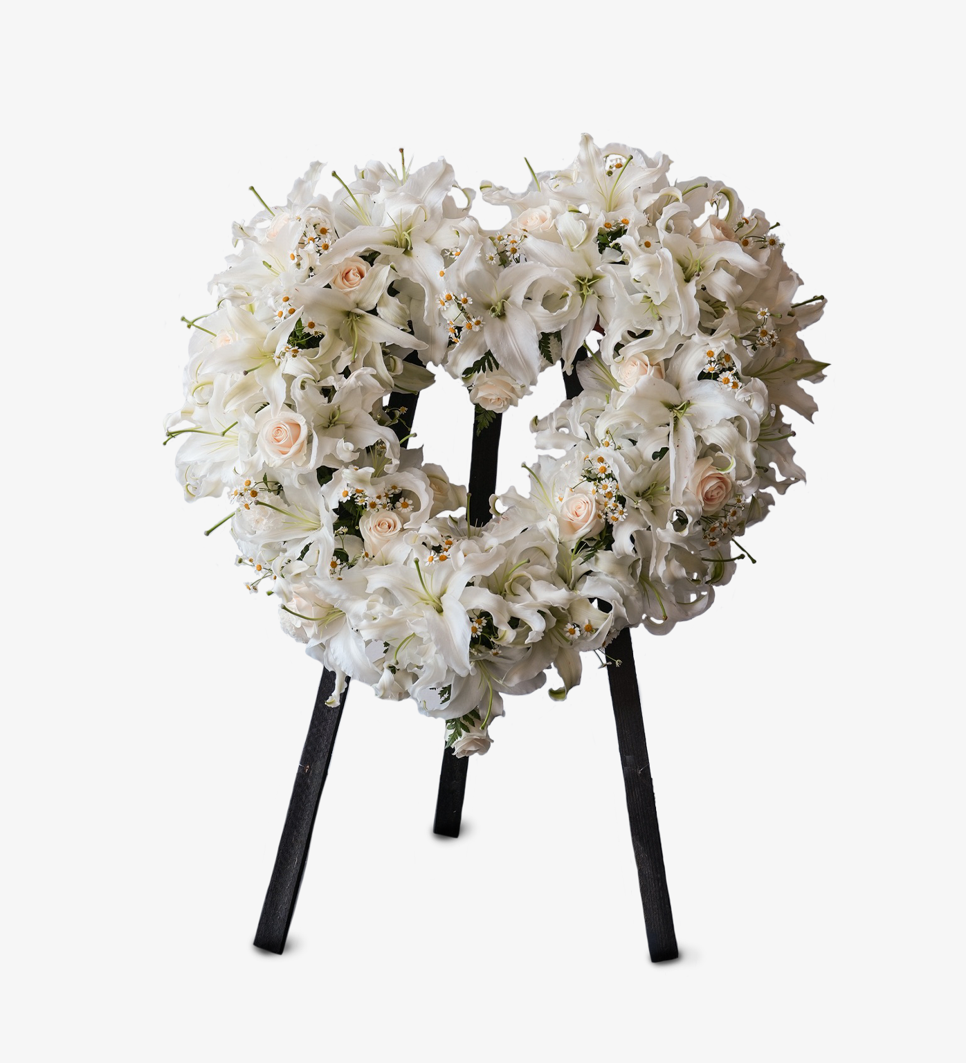 
Kenzie white lily and rose funeral wreath arrangement on black stand with circular design