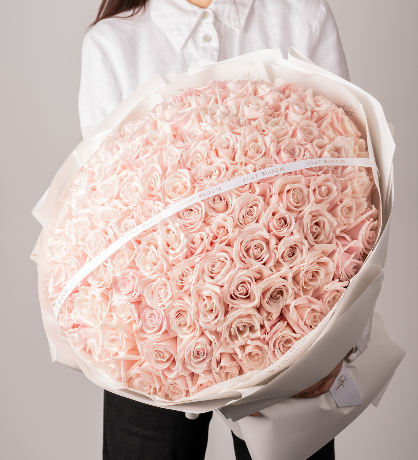 Close-up view of Lennon pink rose bouquet showing gradient pink tones and premium quality